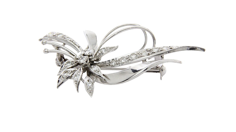 Gold brooch with 0.81 crt. diamond 14 krt