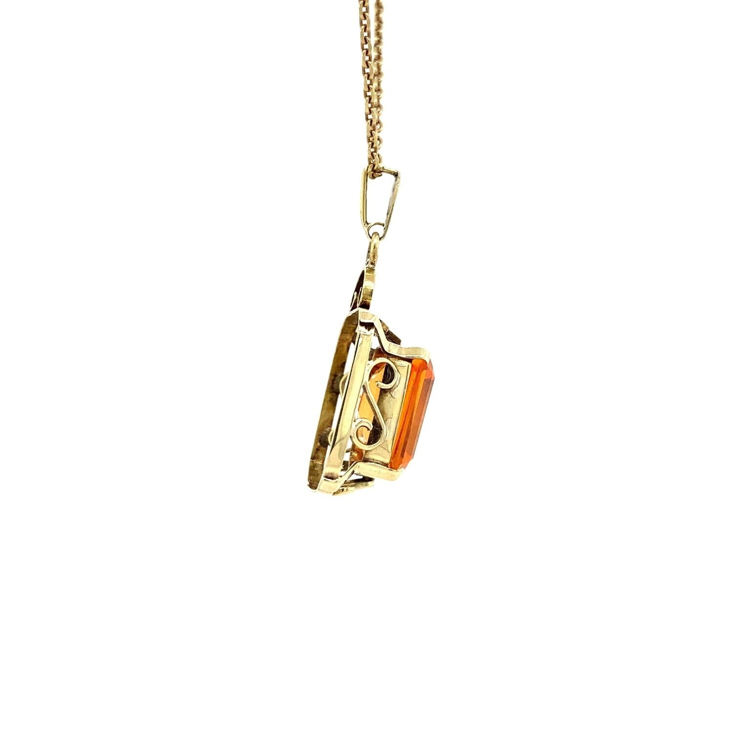 Gouden hanger met oranje saffier 14 krt