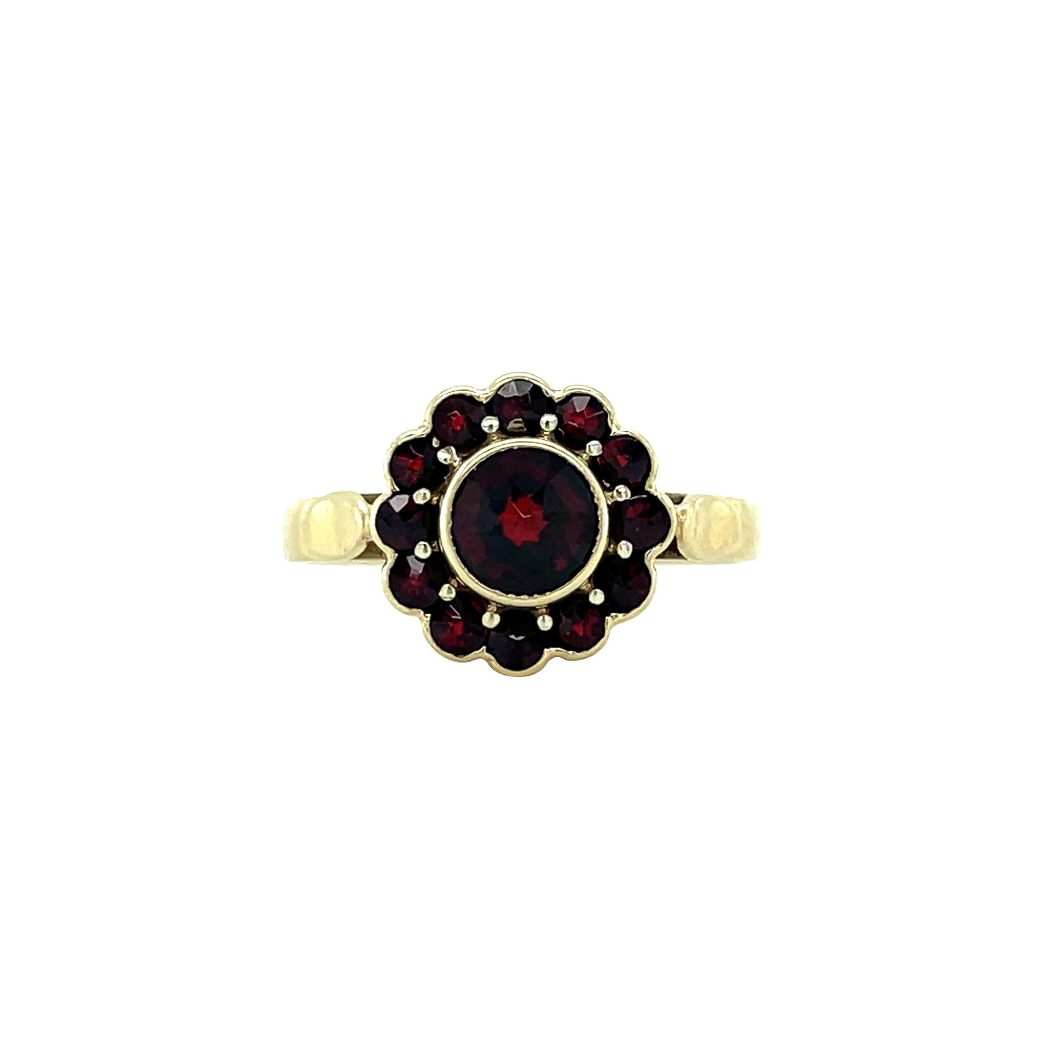 Vintage gold entourage ring with glass garnet, 14 kt