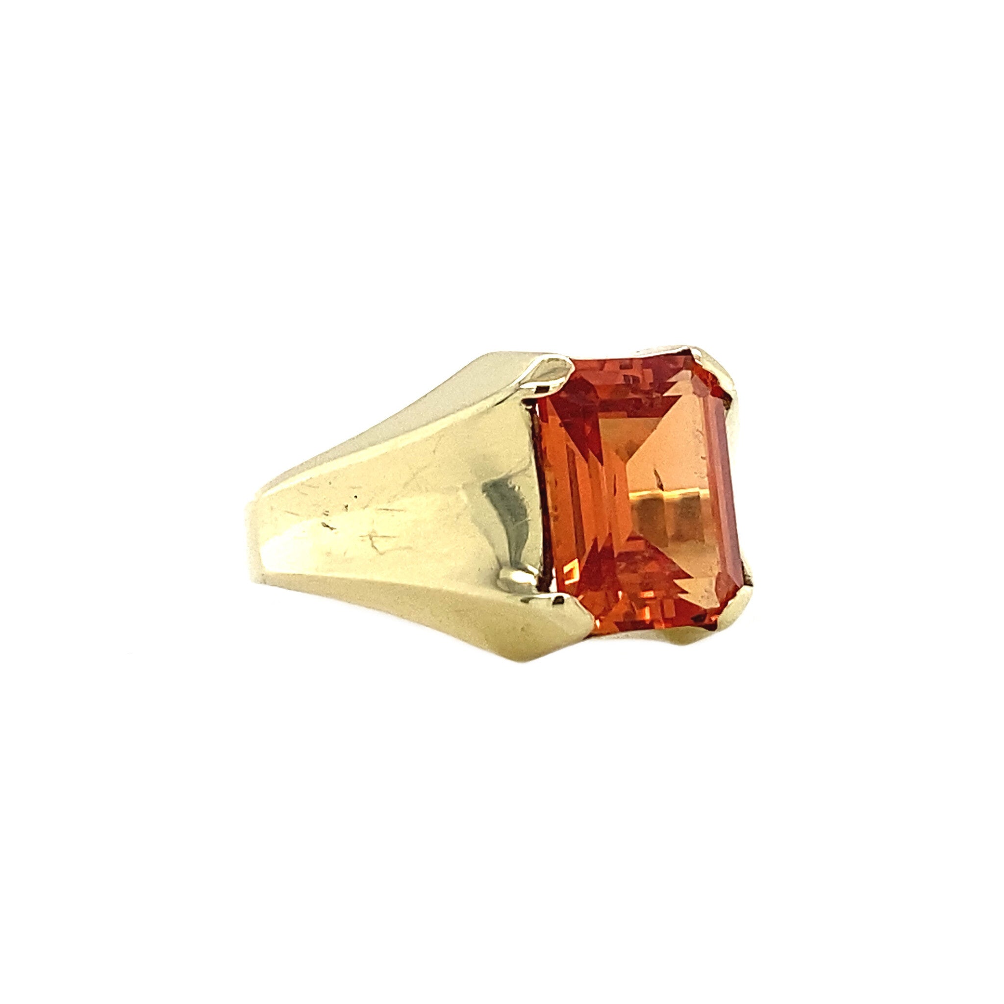14 kt gold pinky ring with an orange sapphire
