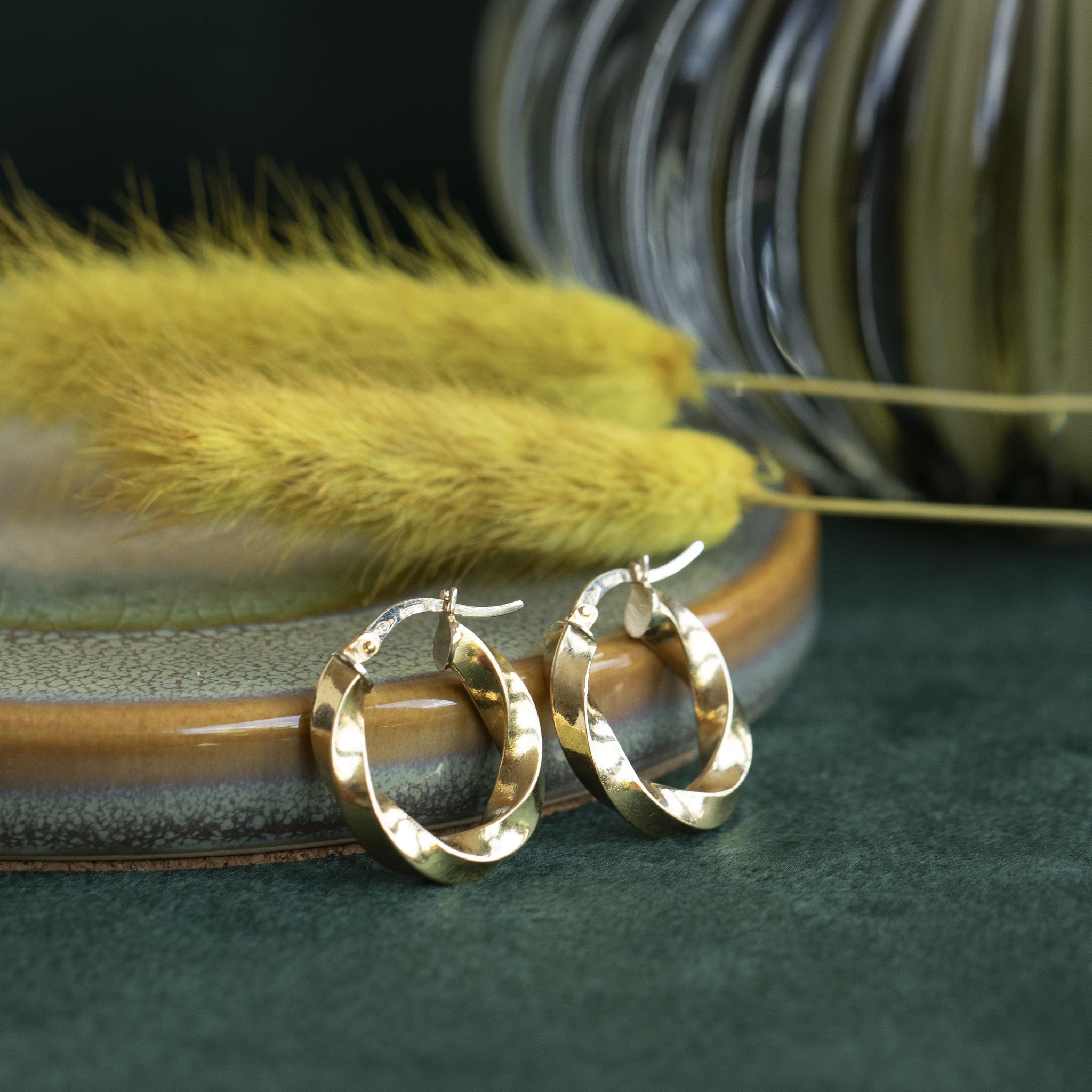 Gouden roterende oorringen 18 krt