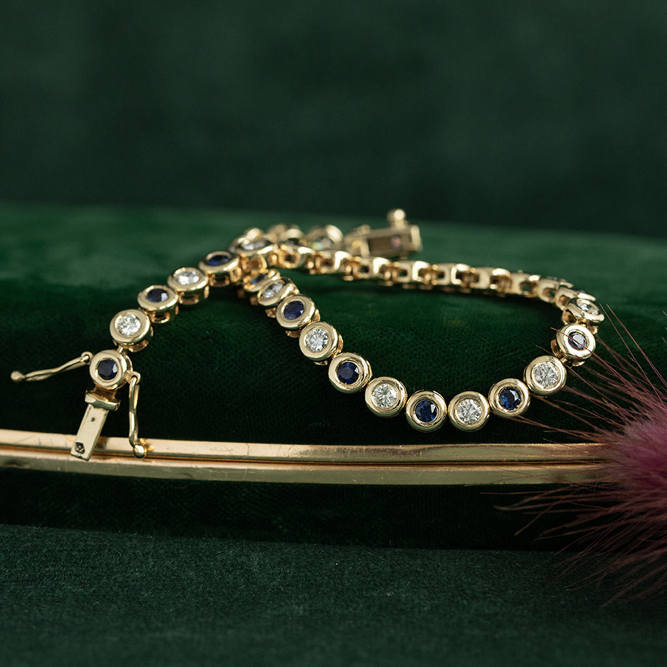 Gouden vintage tennisarmband met saffier en diamant 18 krt