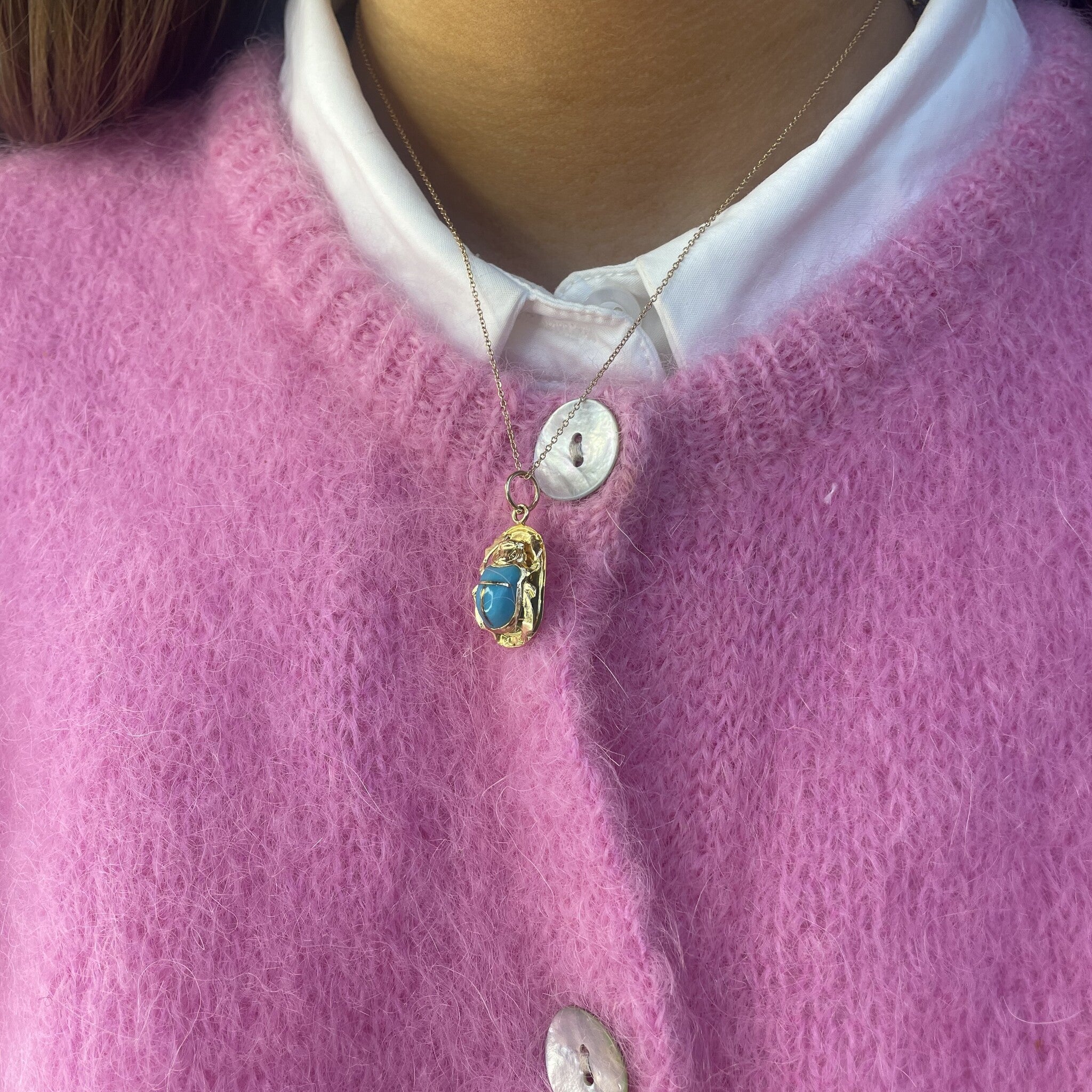 18 kt gold scarab pendant with blue gemstone