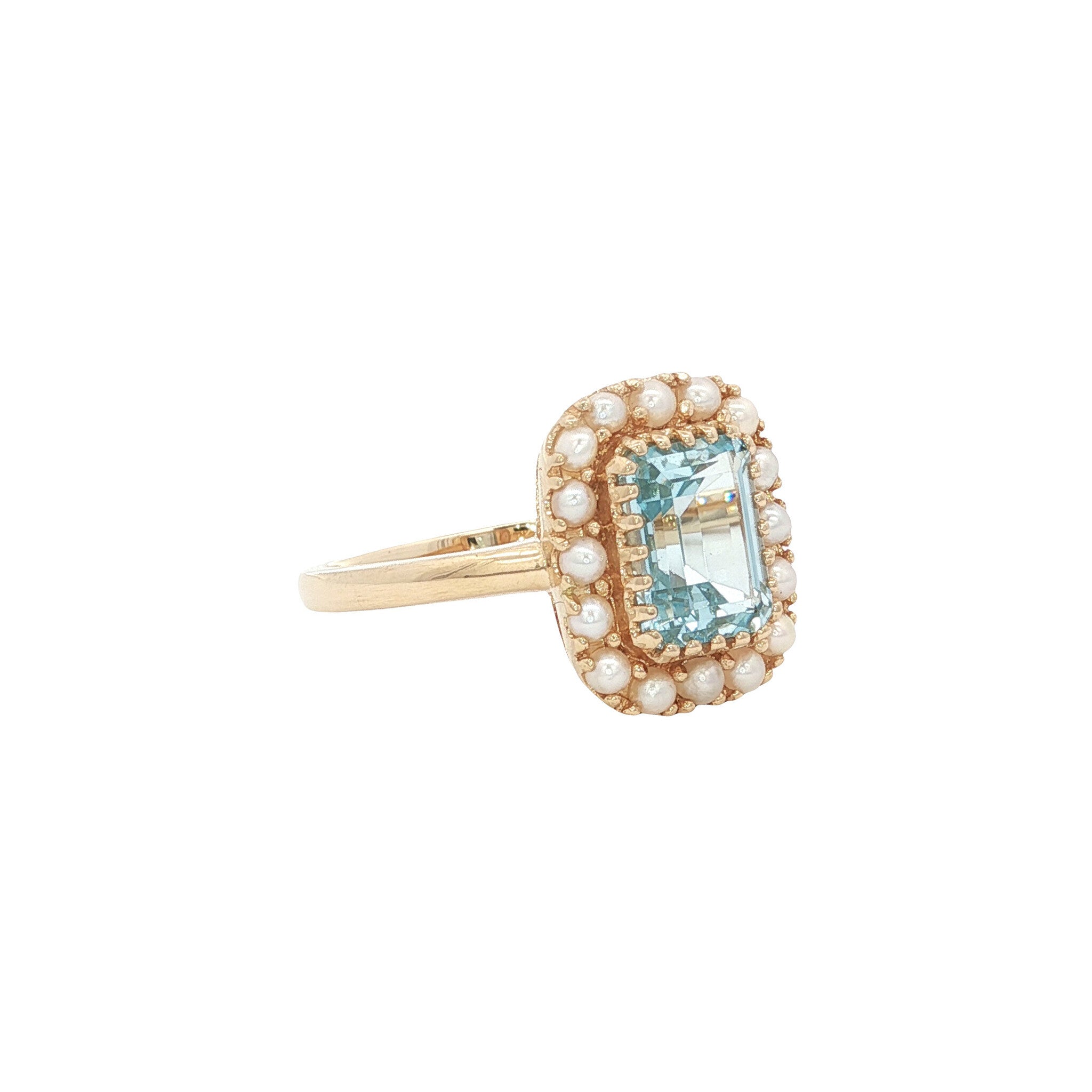 14 kt gold ring with blue topaz and pearl