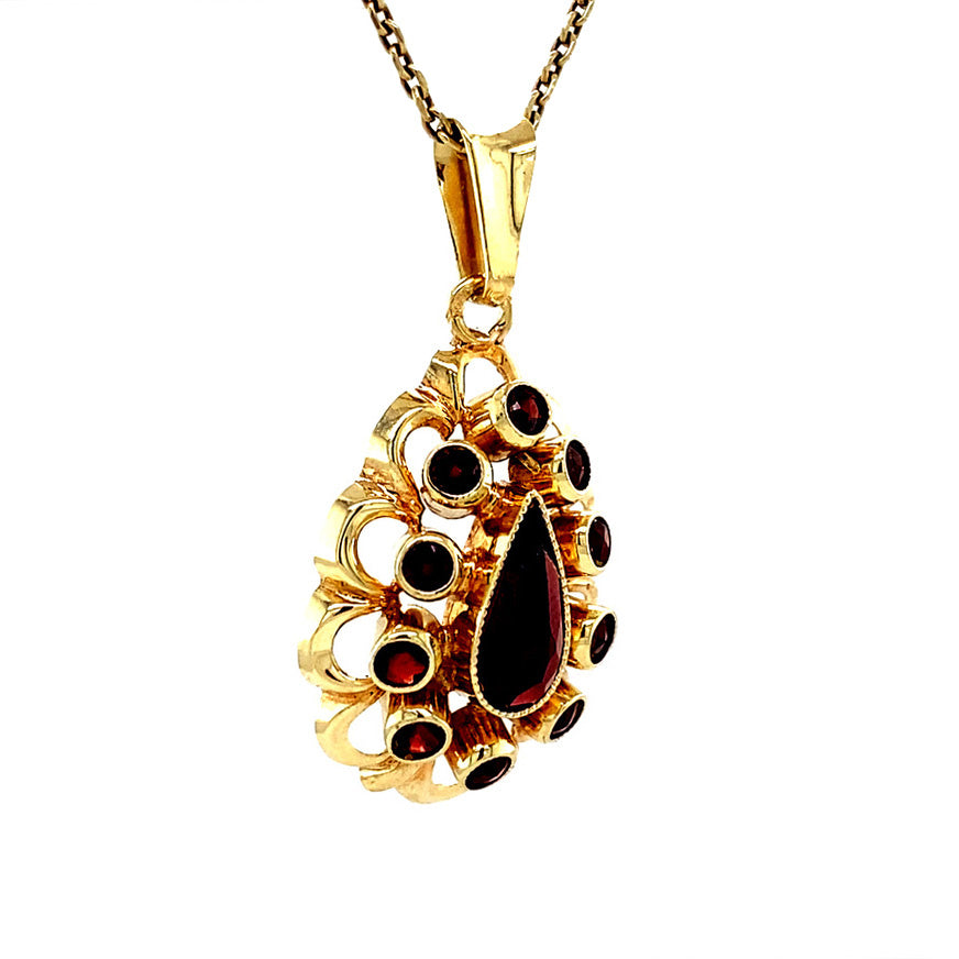 Gouden vintage entourage hanger met granaat 14 krt