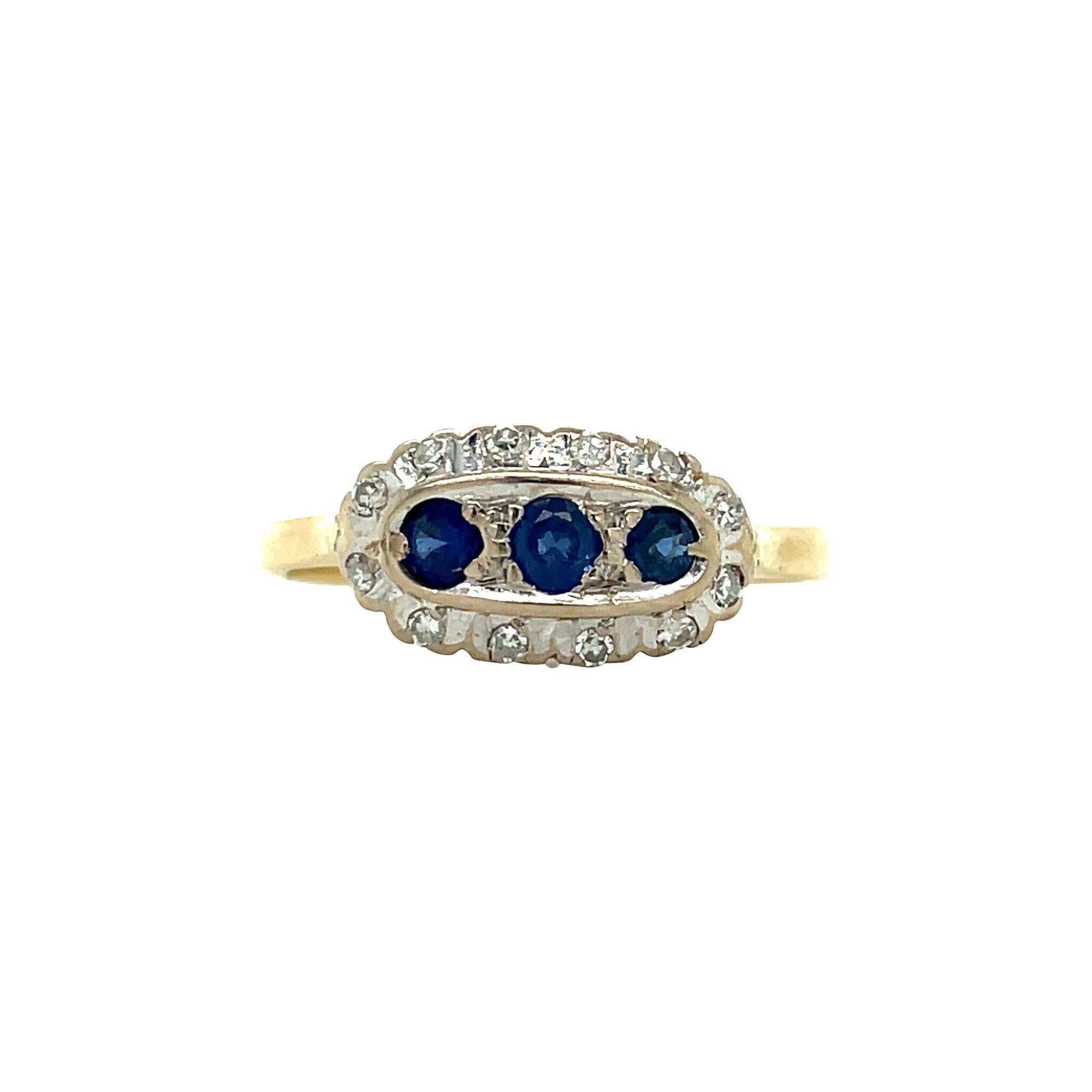 18 kt vintage gold entourage ring with sapphire and diamond