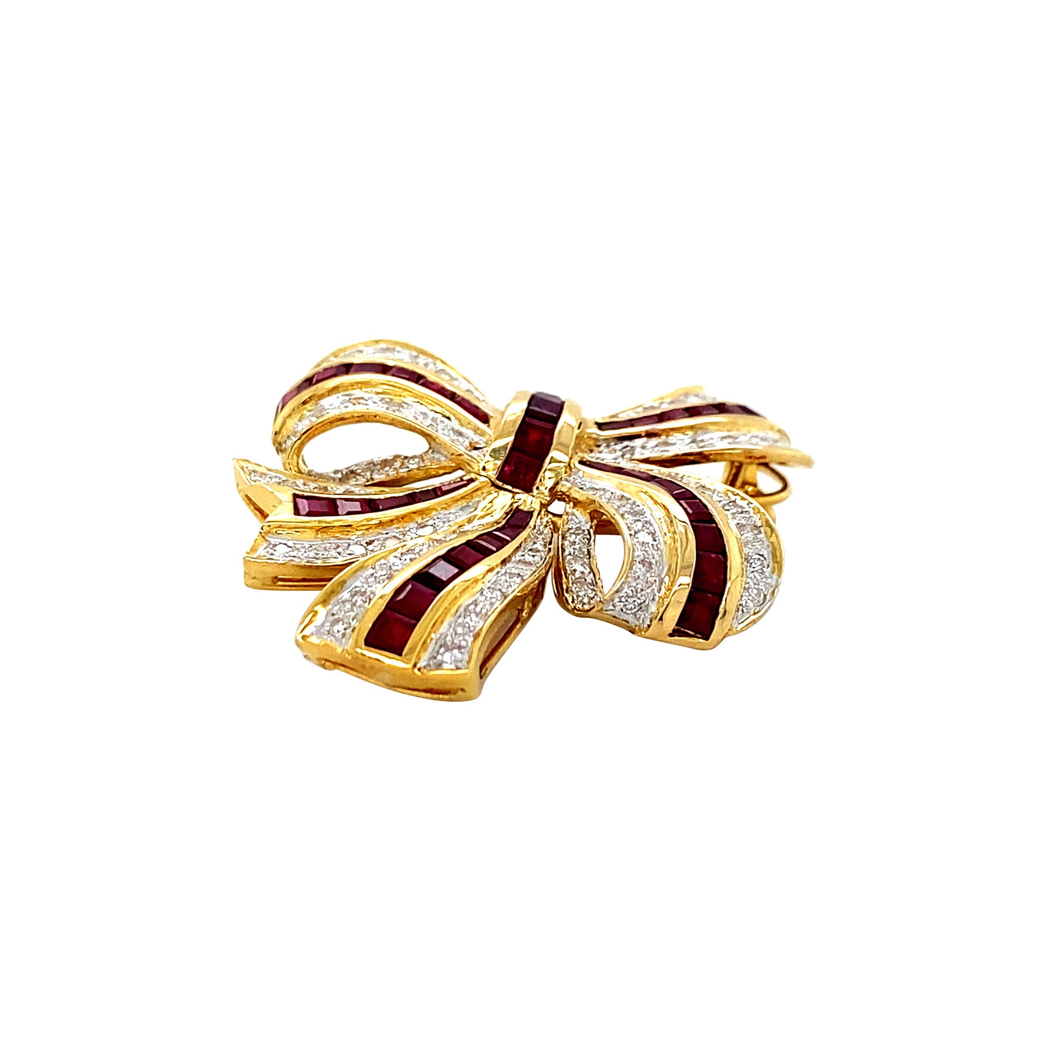 Golden bow brooch with ruby and diamond 18 kt