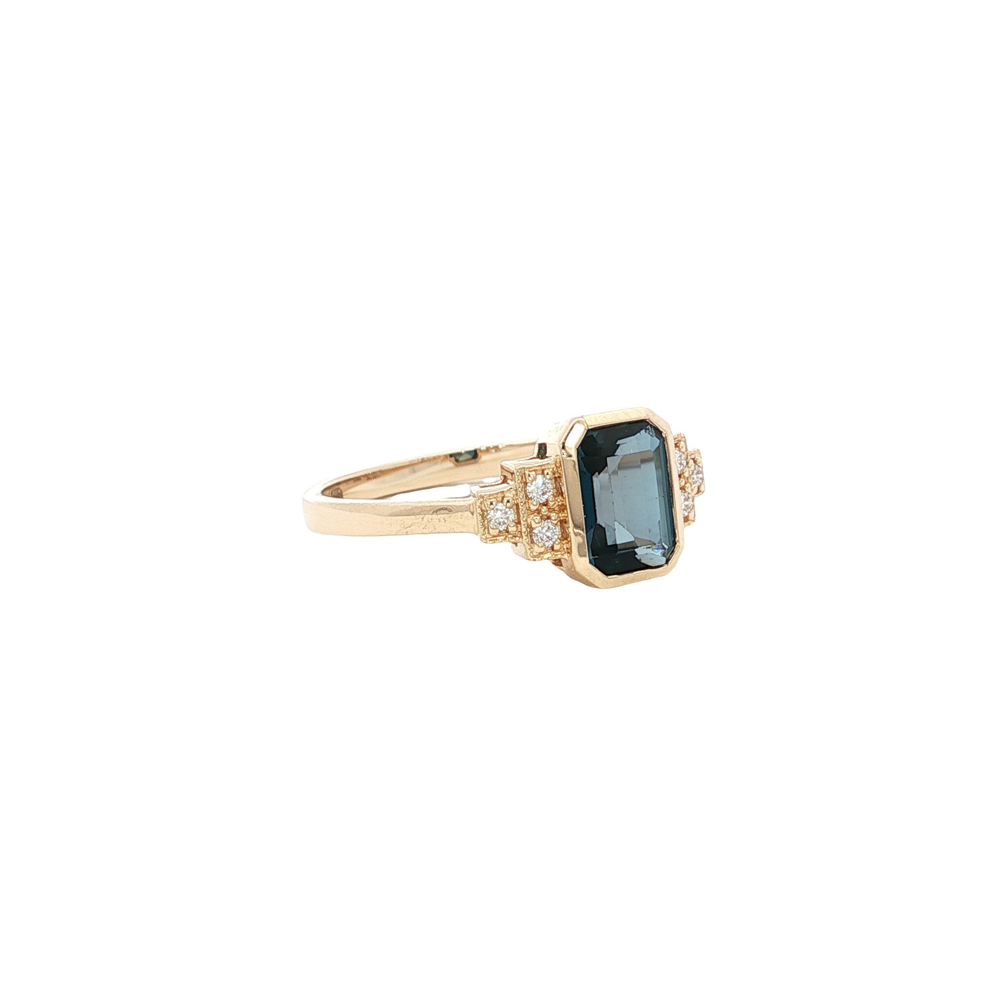 14 kt gold ring with blue topaz and diamond
