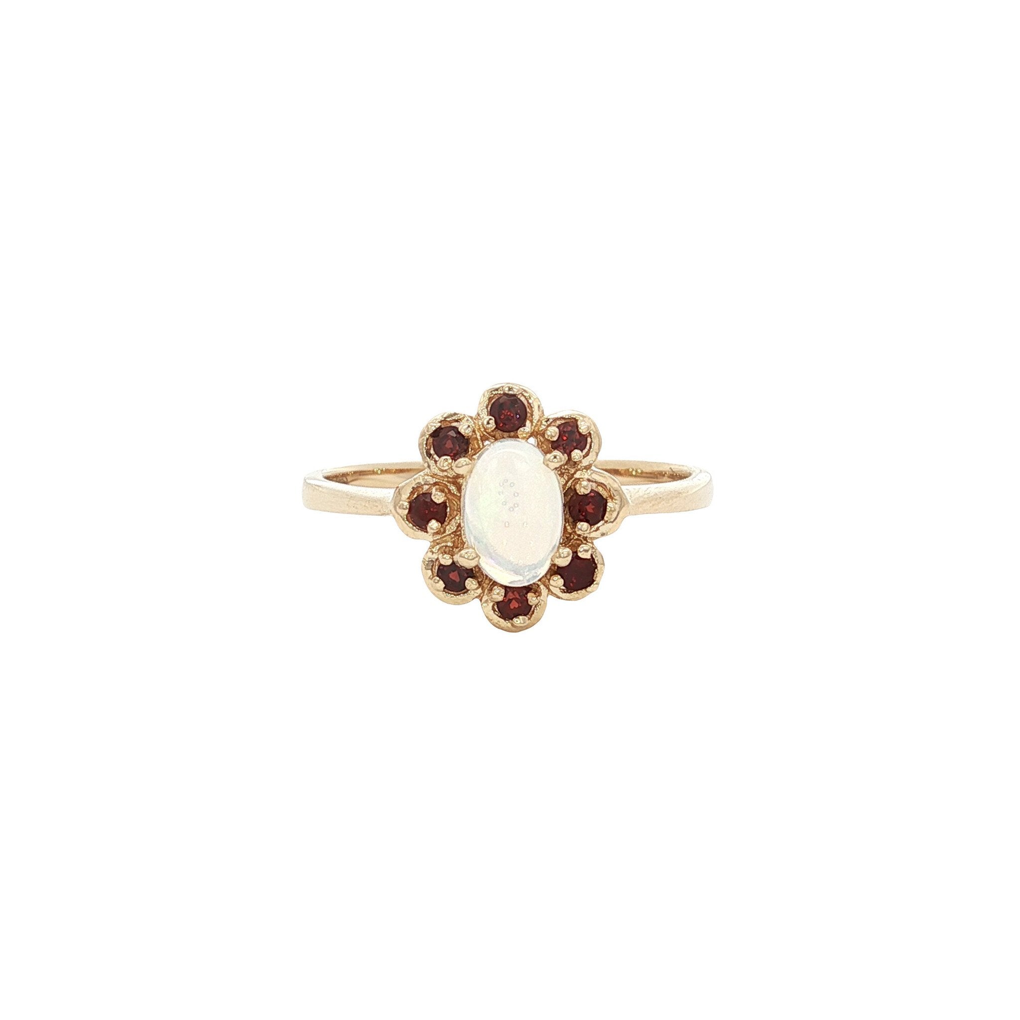 Gold ring with opal and garnet 14 kt