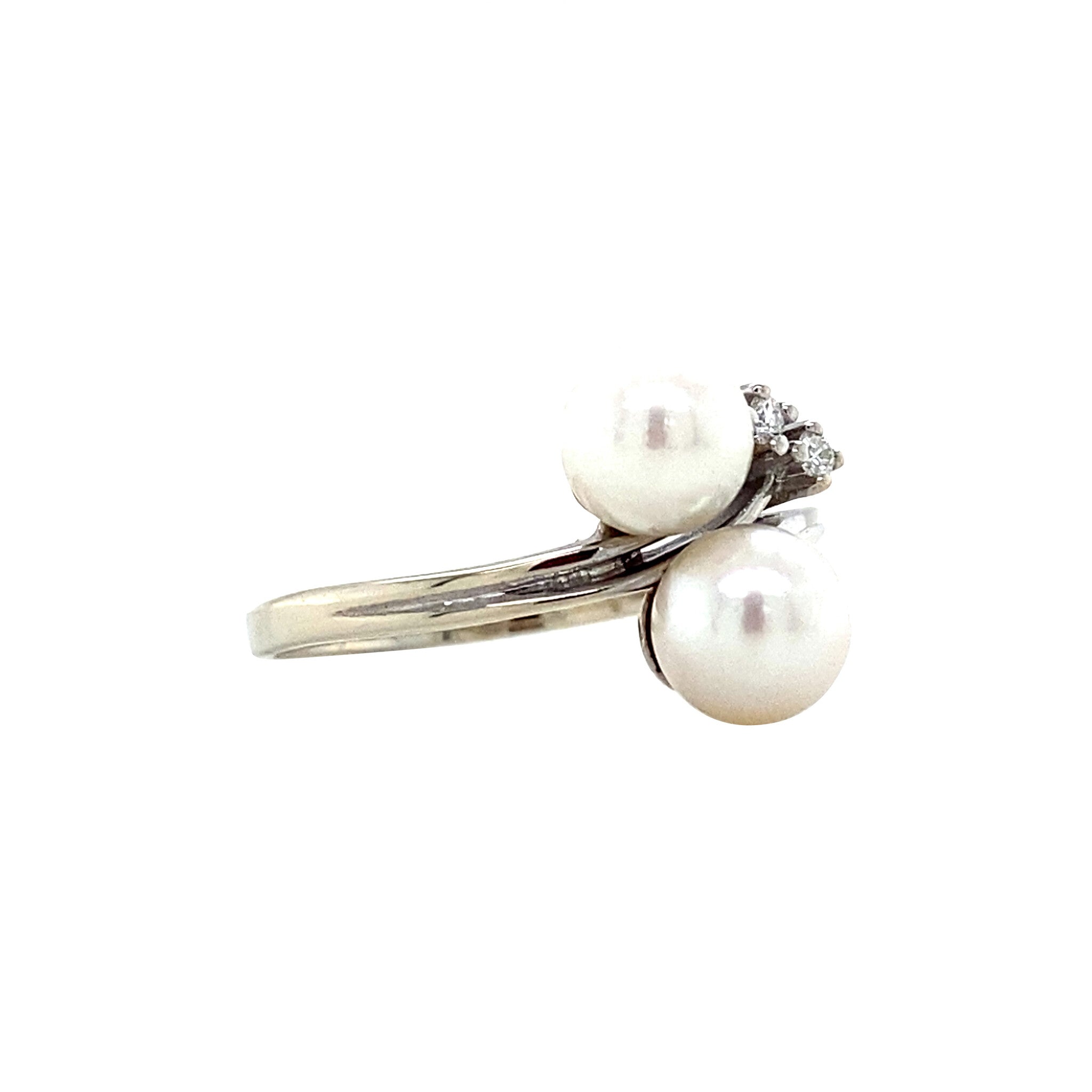 Witgouden vintage ring met parel en diamant 14 krt