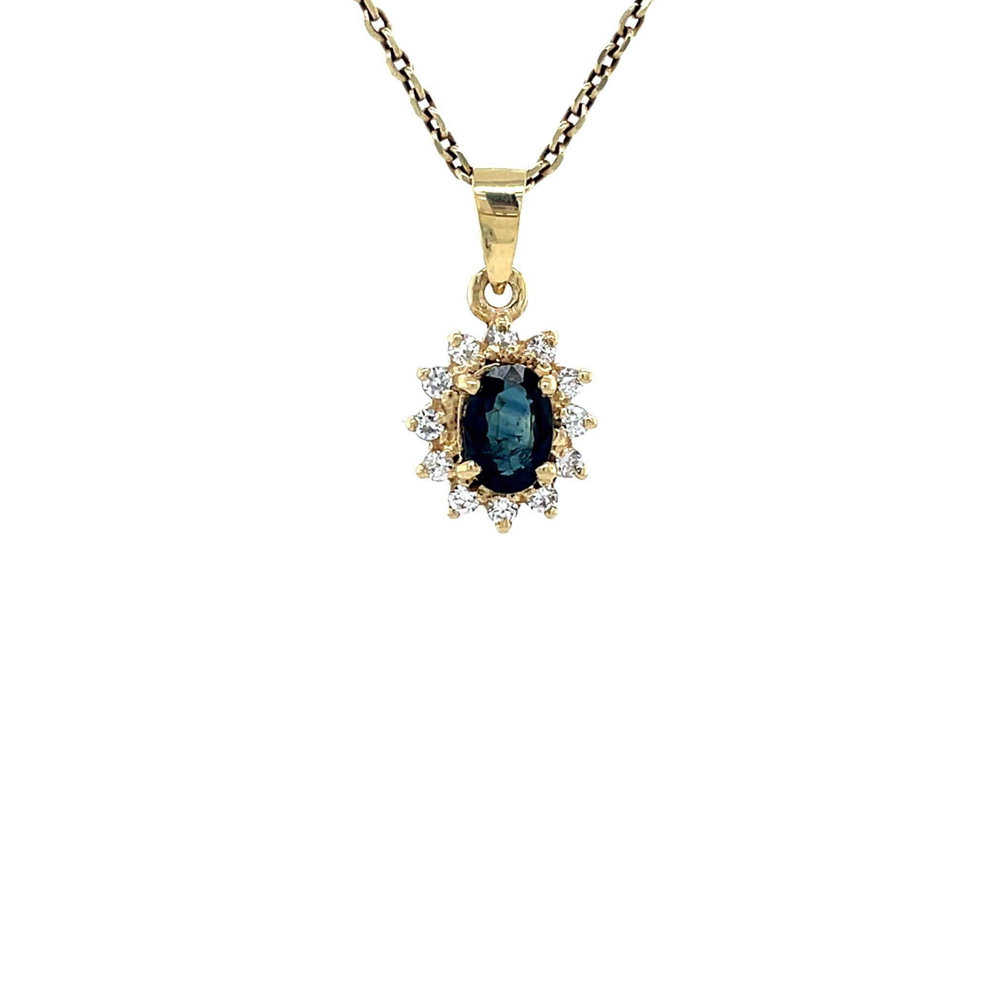 Vintage 14 kt gold entourage pendant with sapphire and zirconia