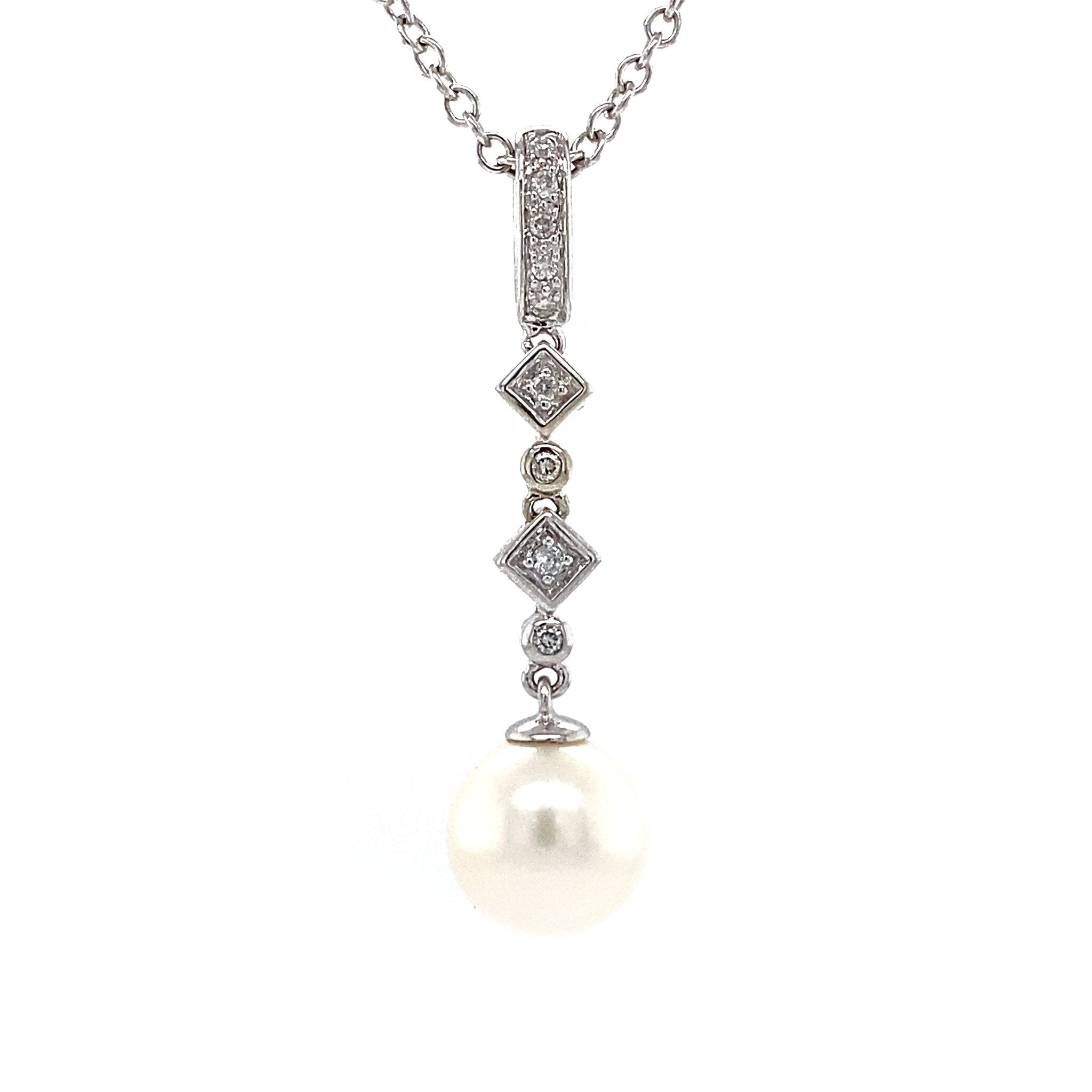 White gold pendant with diamond and pearl 14 krt