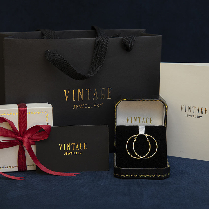 Gouden vintage fantasie oorringen 14 kt