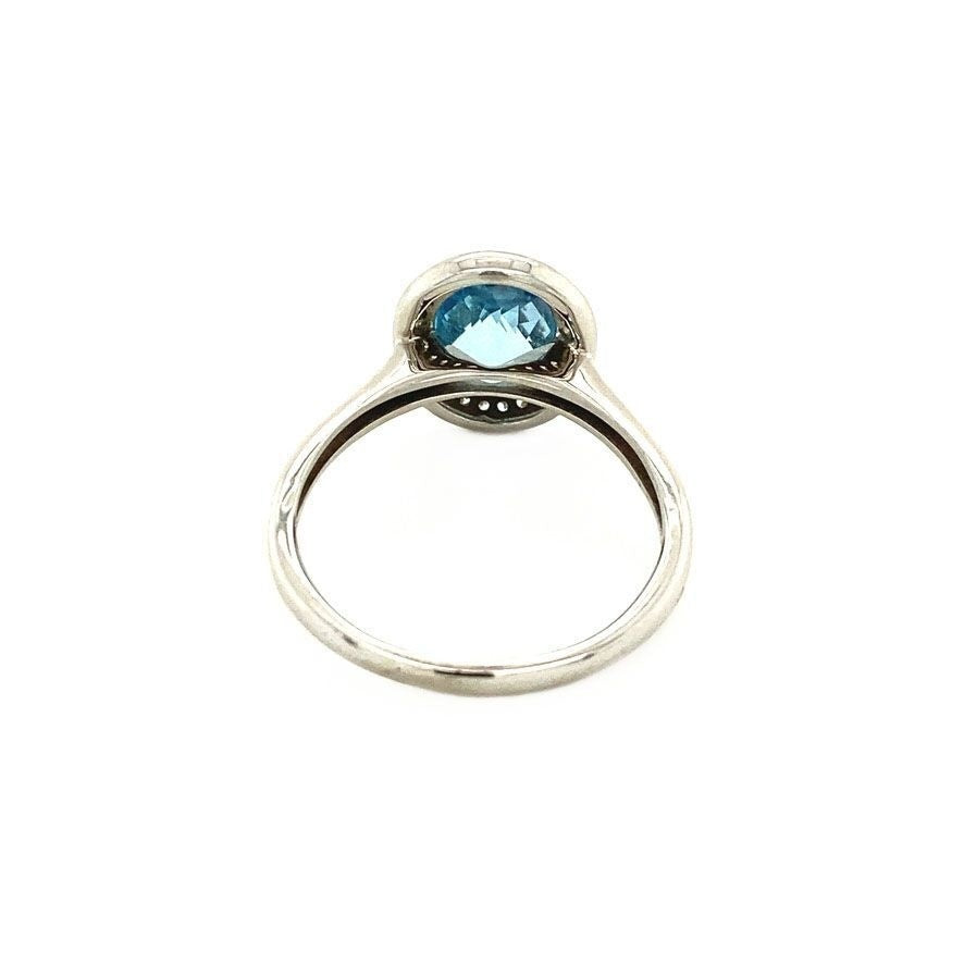 14 kt white gold ring with topaz and diamond