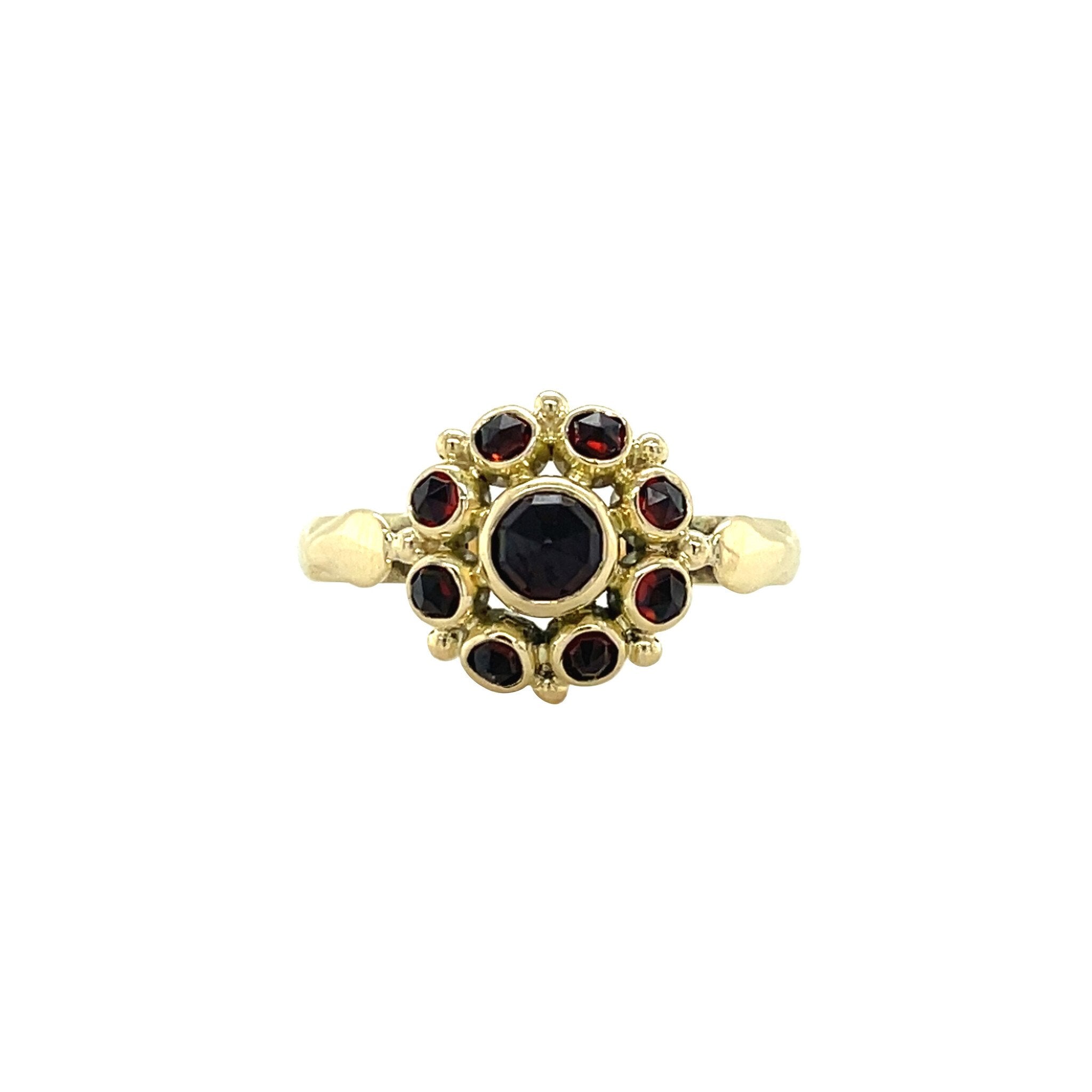 Vintage 14 kt gold entourage ring with garnet