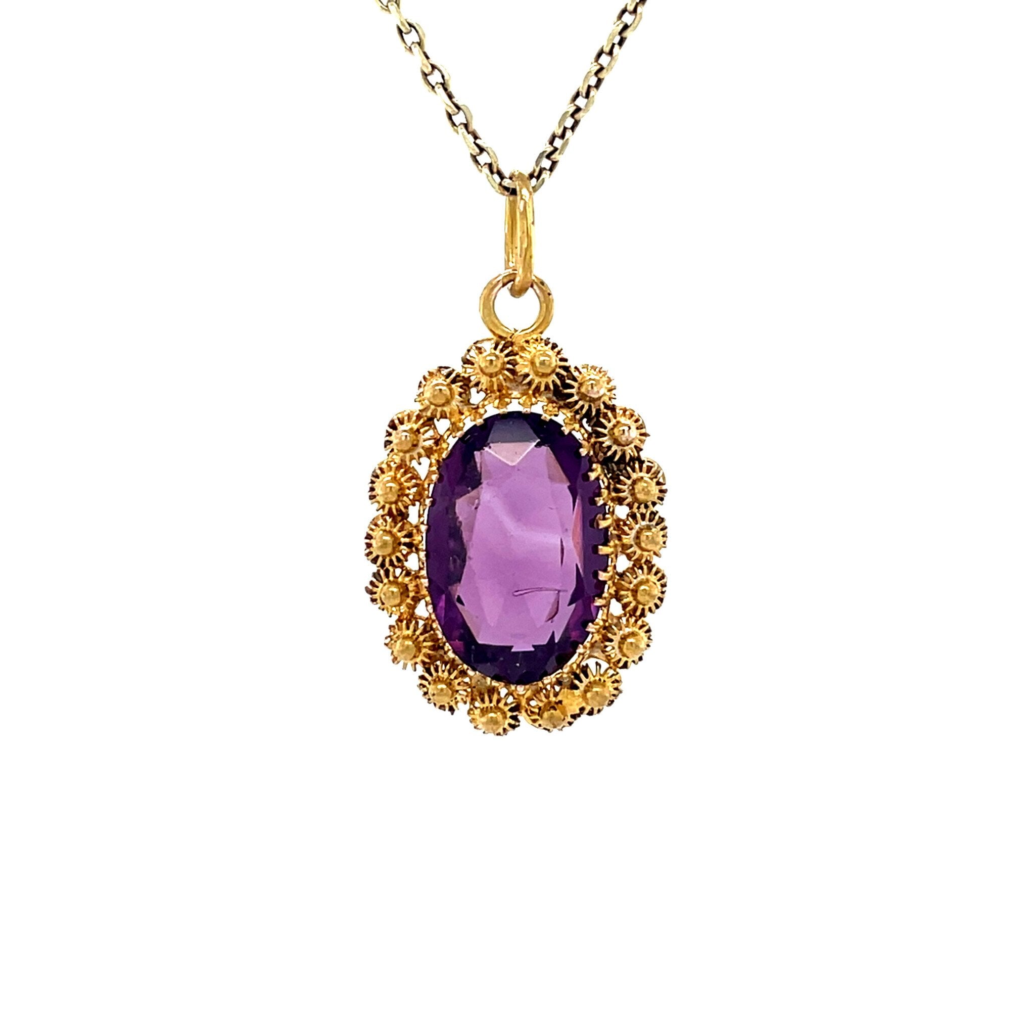 Vintage 20 kt gold pendant with colored gemstone
