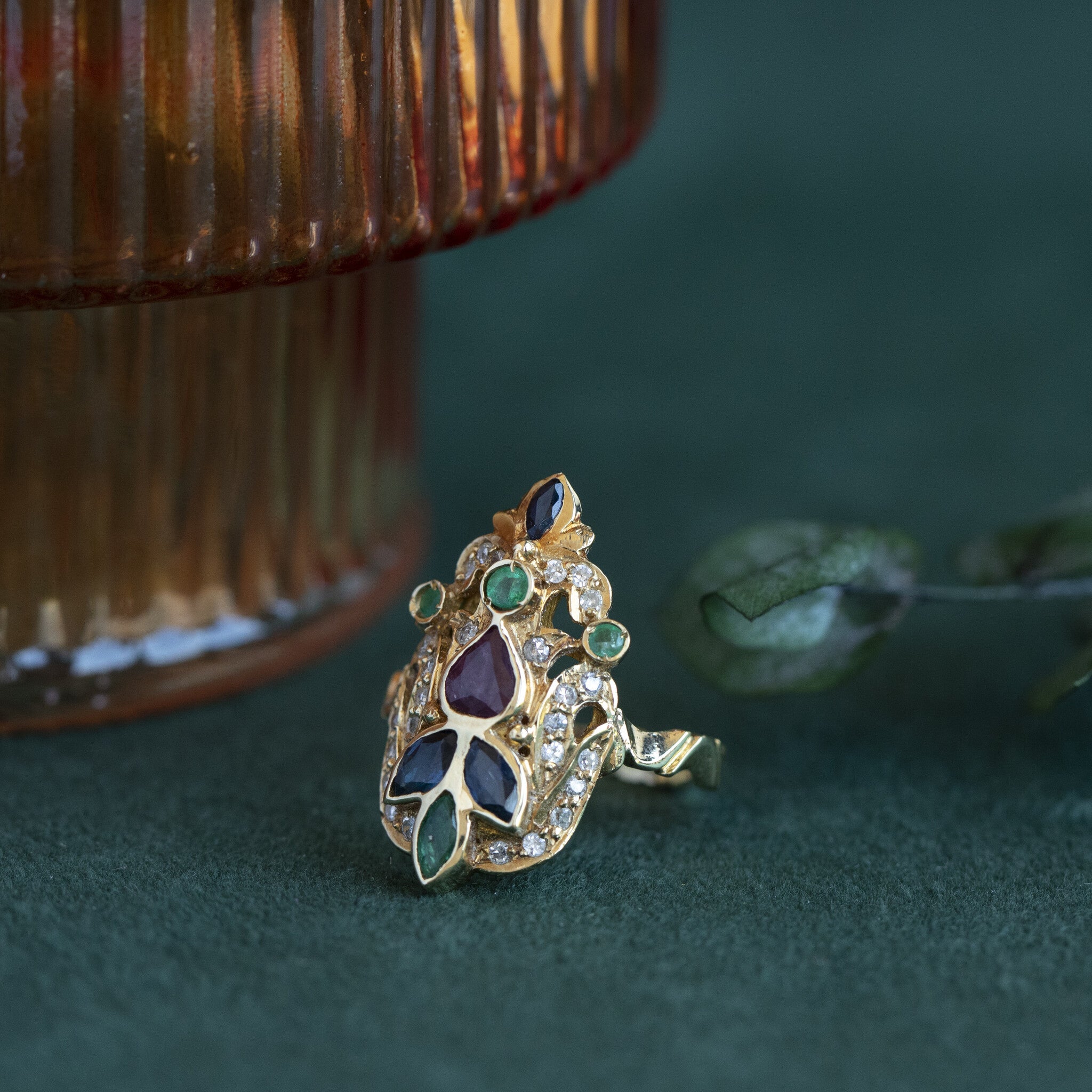 Gold ring with emerald, sapphire, ruby and diamond 18 krt