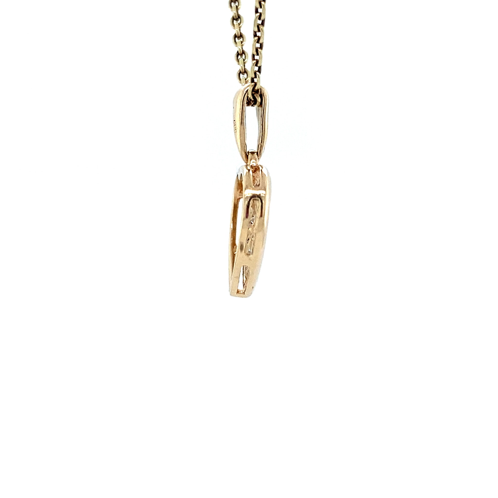 Vintage 14 kt gold heart pendant with diamond.