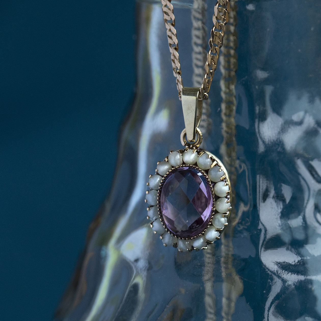 Gouden hanger met amethist en parel 14 krt