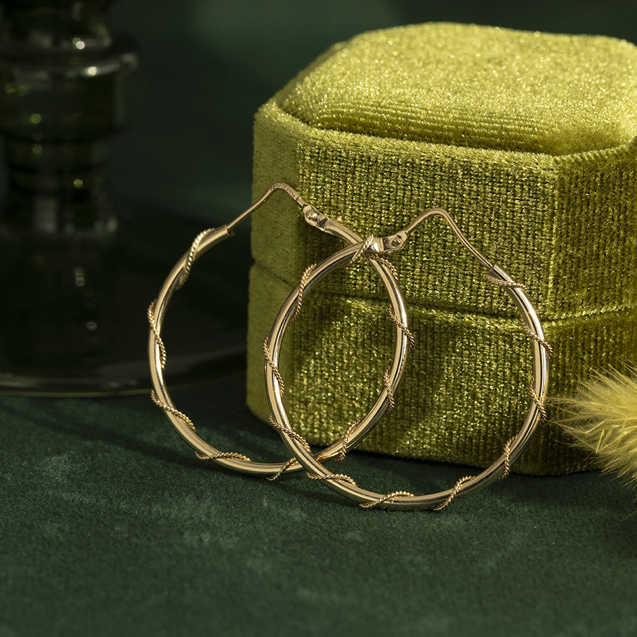 Gouden vintage fantasie oorringen 14 krt