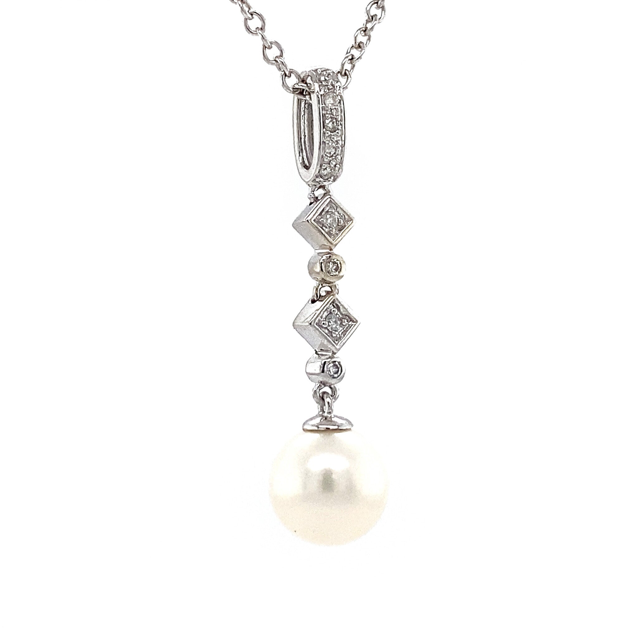 White gold pendant with diamond and pearl 14 krt