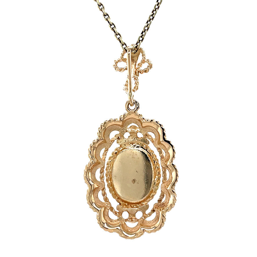 Gold vintage pendant with garnet 14 kt
