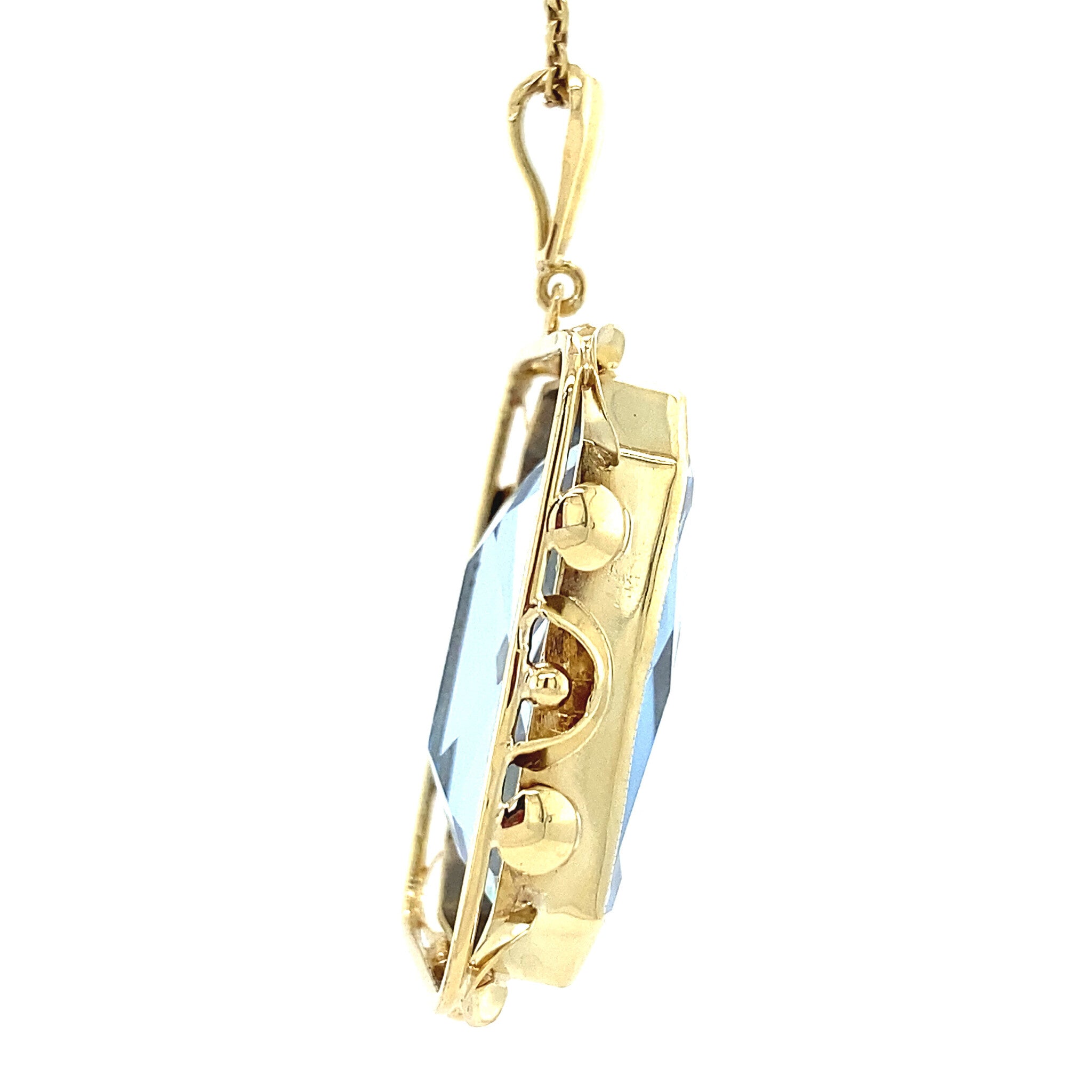 Gold pendant with blue spinel 14 kt
