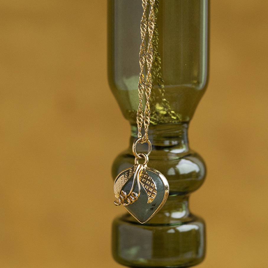 Gouden hanger met jade 14 krt