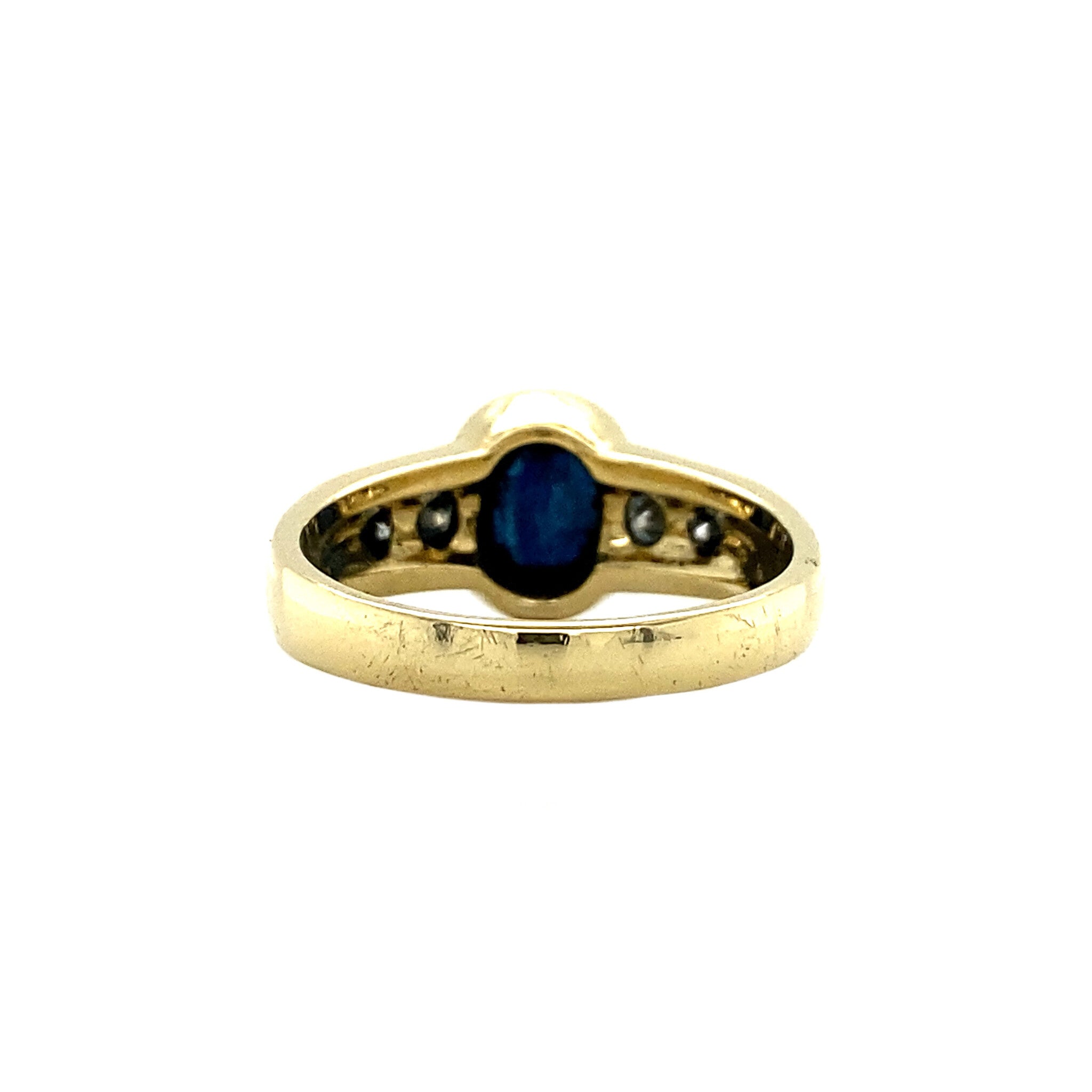 18 kt gold ring with diamond and sapphire