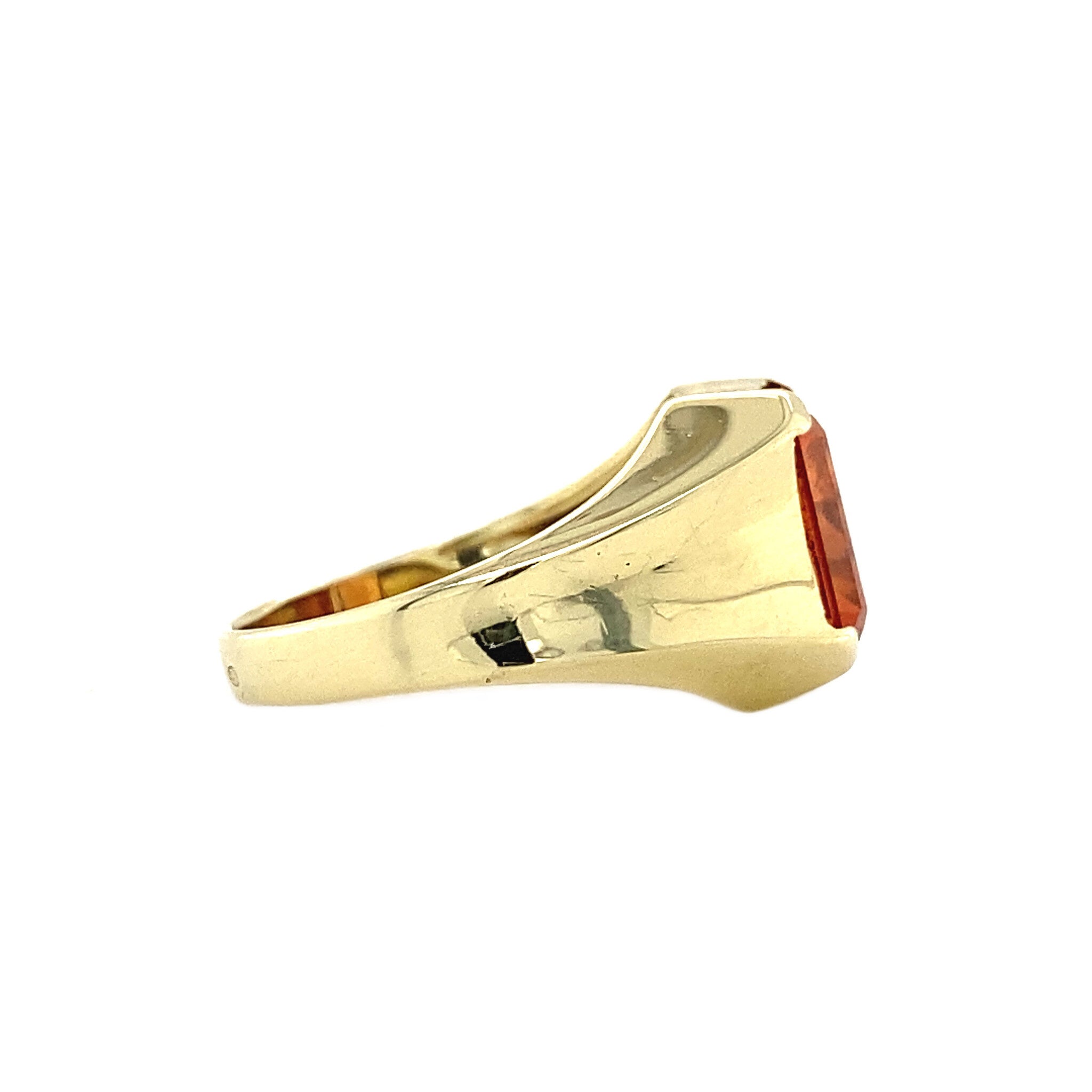 14 kt gold pinky ring with an orange sapphire