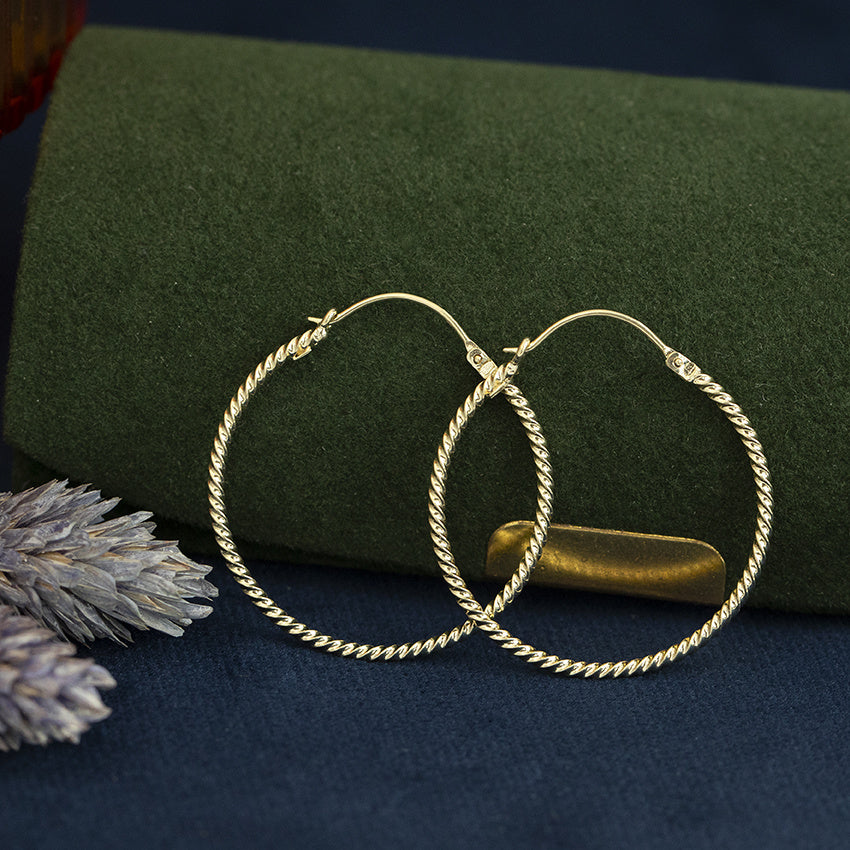 Gouden vintage getordeerde oorringen 14 kt