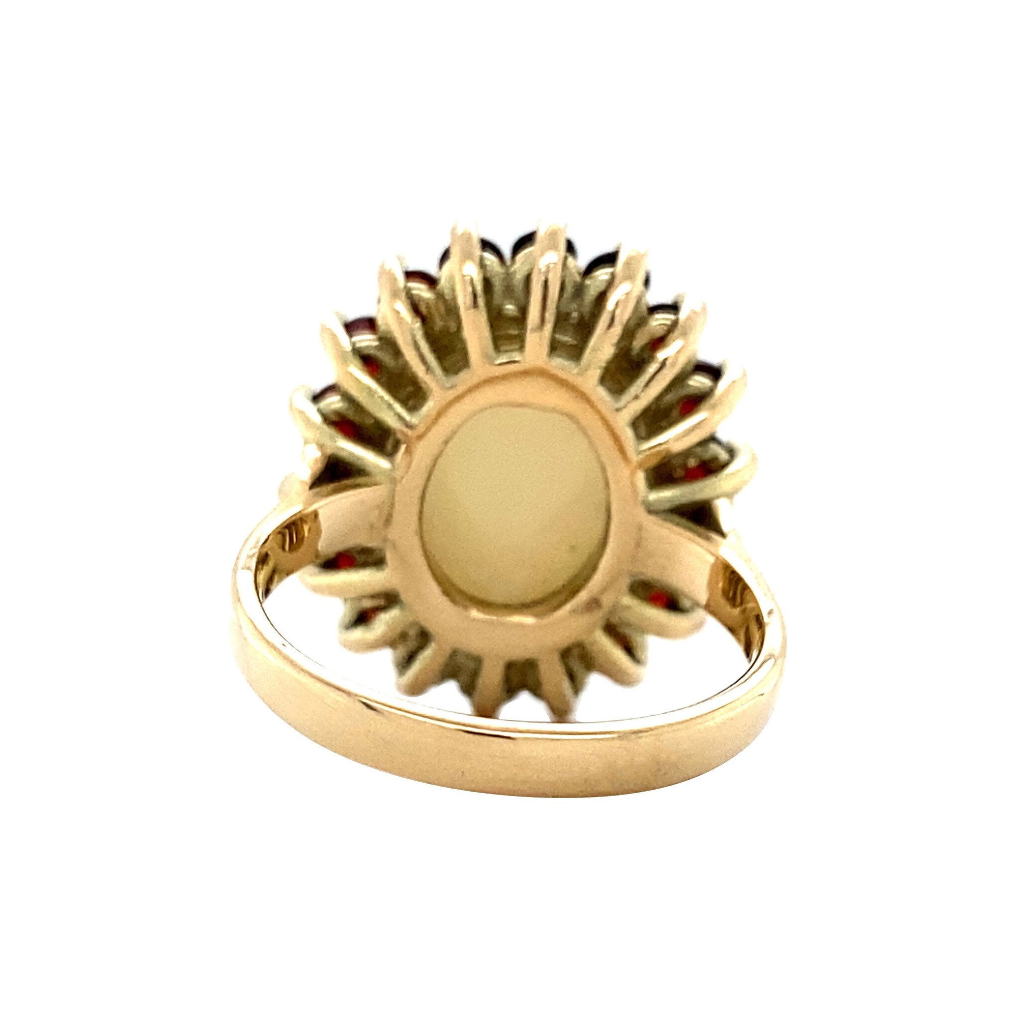 Gouden entourage ring met opaal en granaat 14 krt
