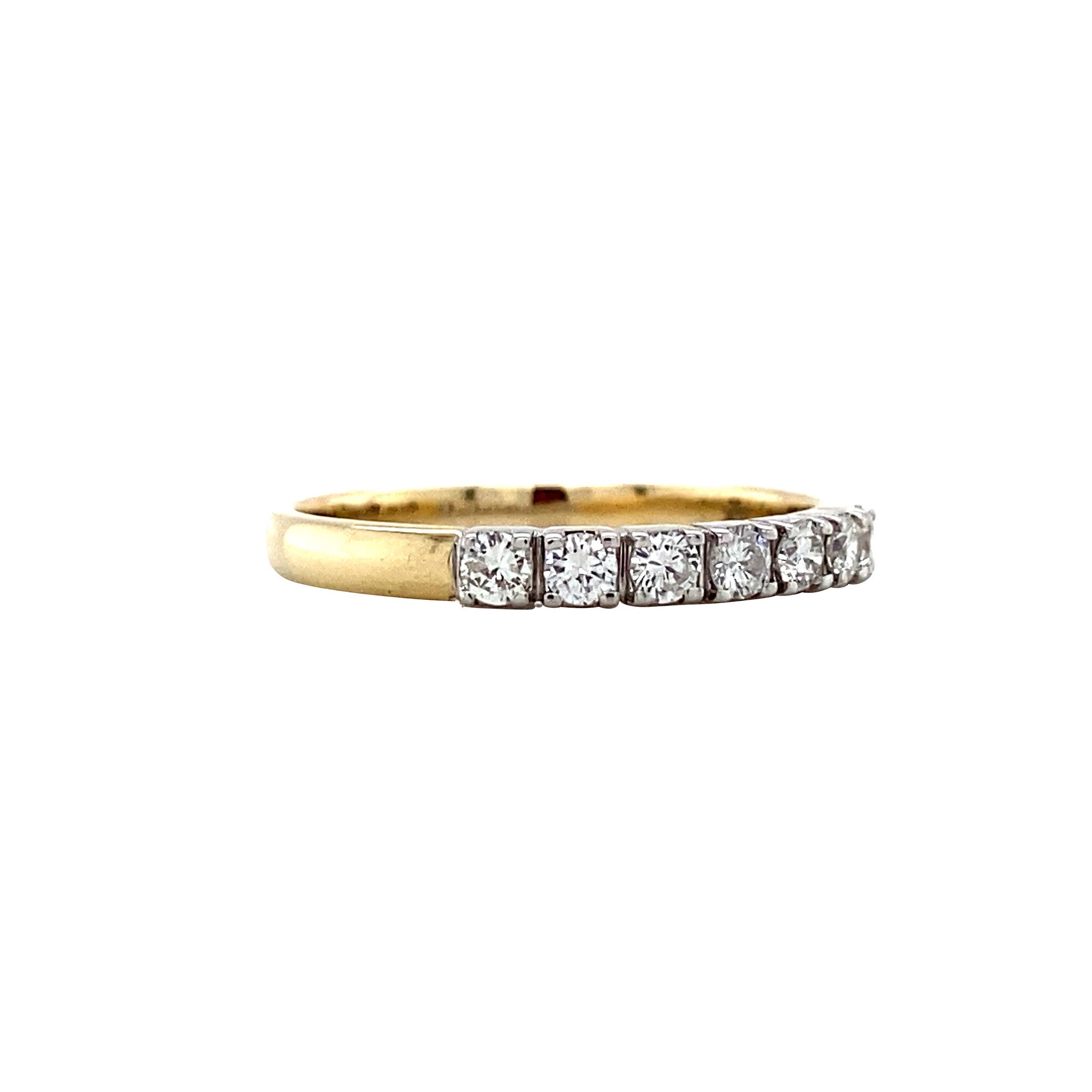14 kt gold row ring with a diamond.