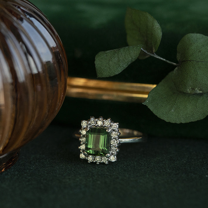 14 kt white gold halo ring with tourmaline and diamond