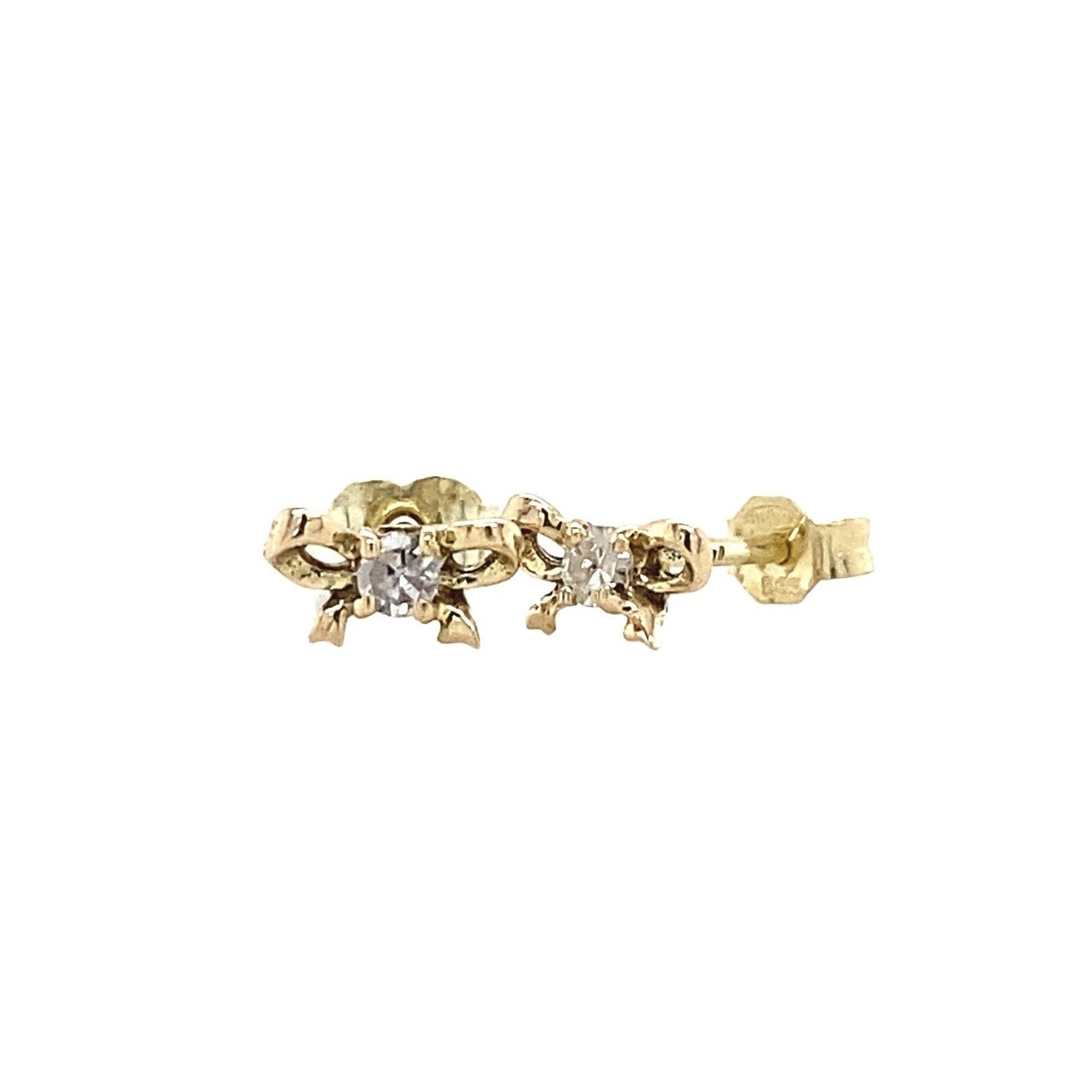 14 kt gold bow stud earrings with diamond