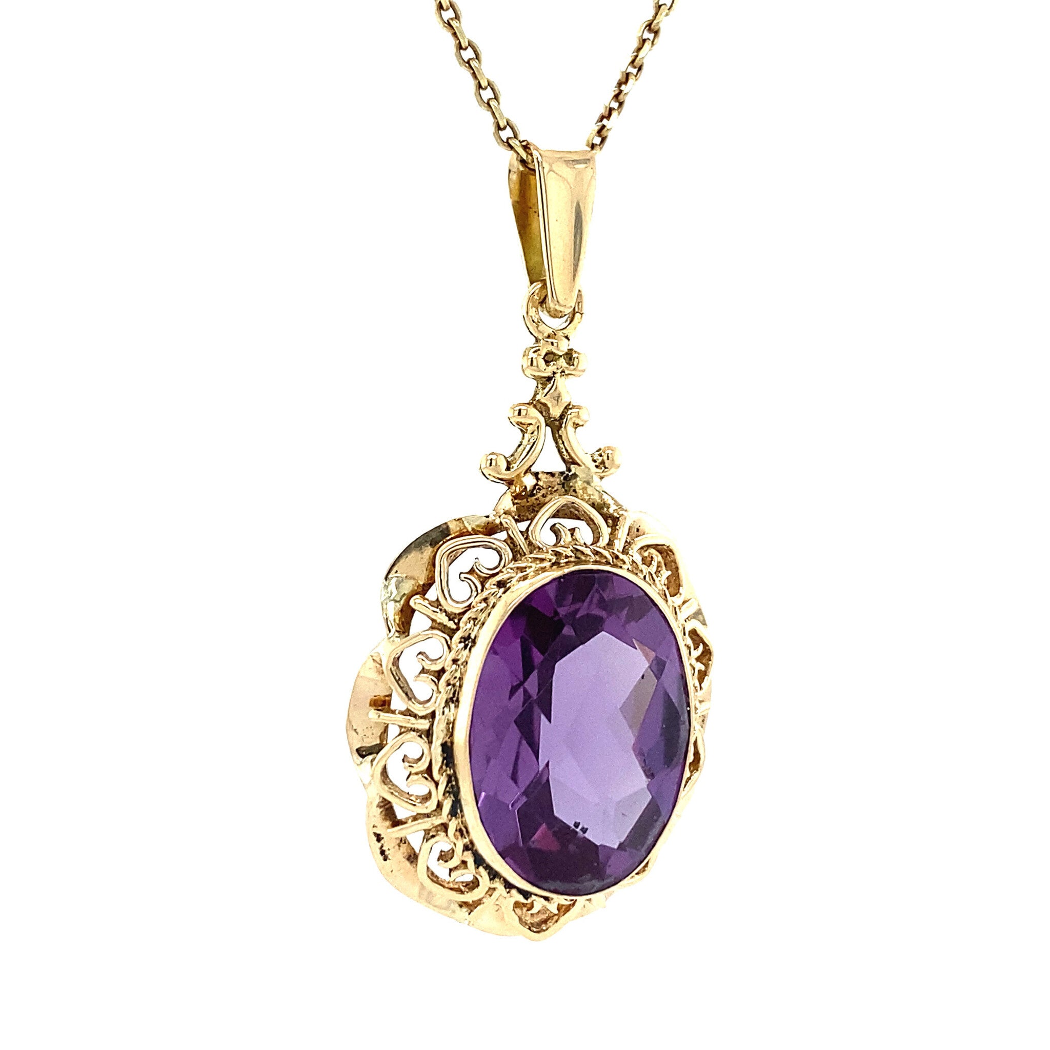 14 kt gold pendant with purple sapphire