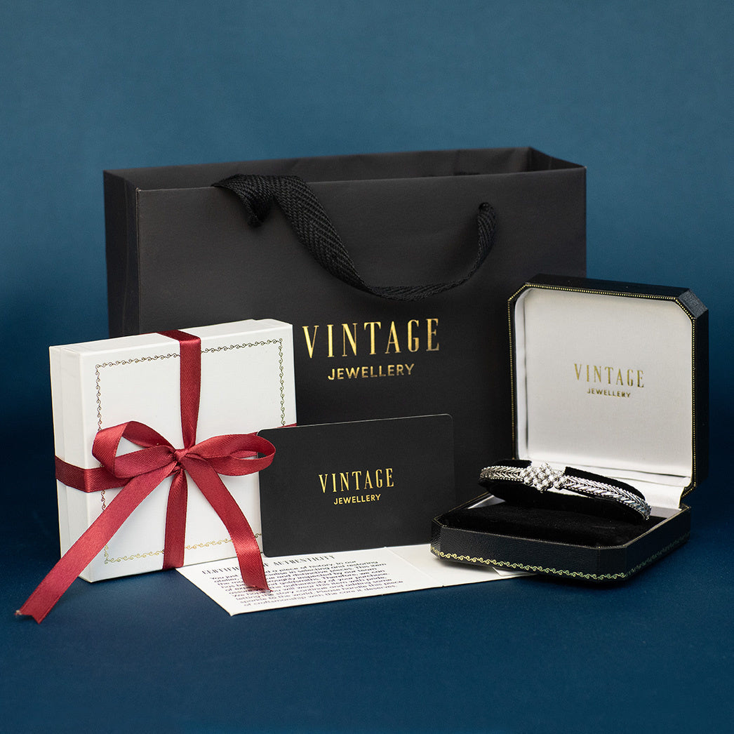 Witgouden vintage entourage armband met saffier en diamant 14 krt