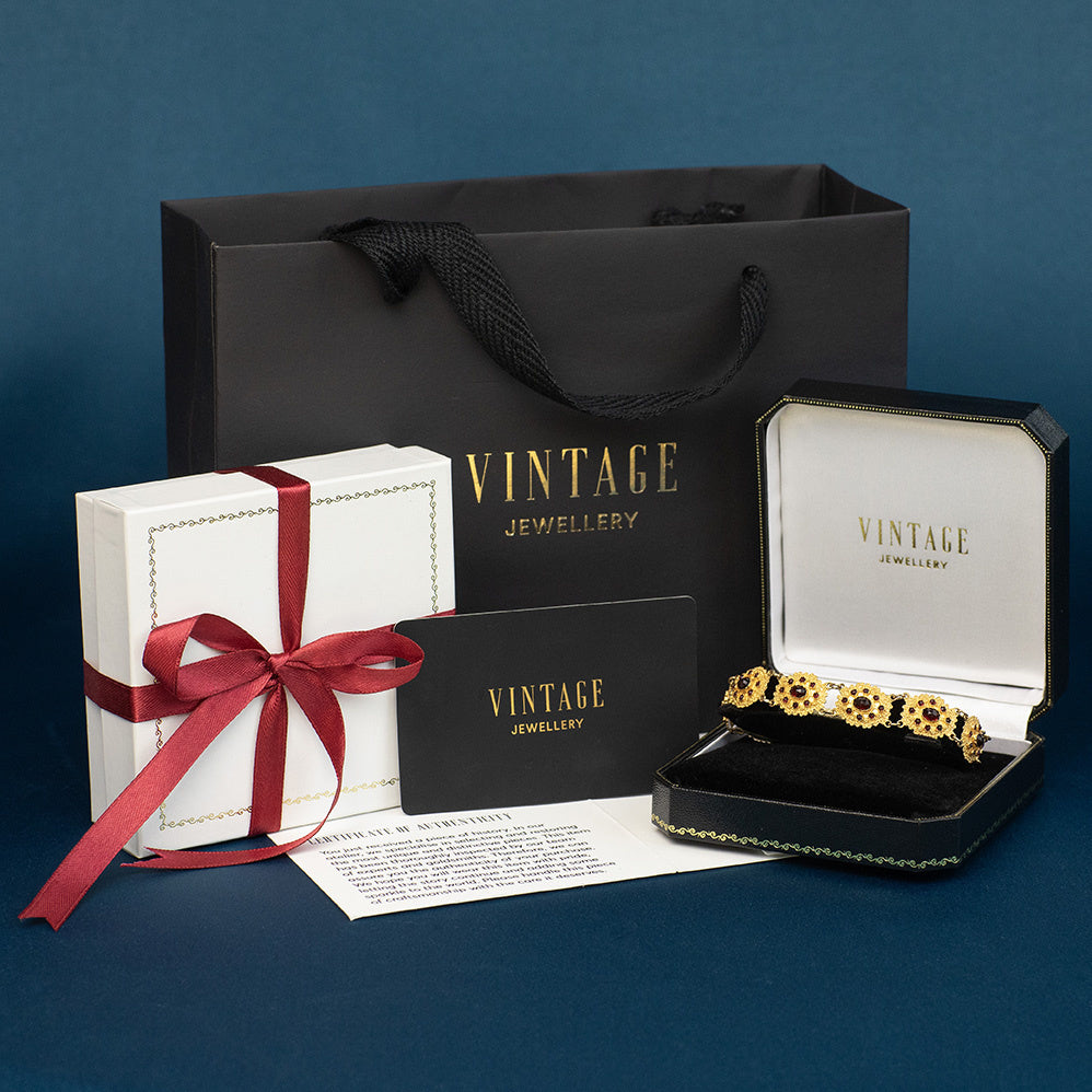 Gouden vintage bootjes armband met granaat 14 kt