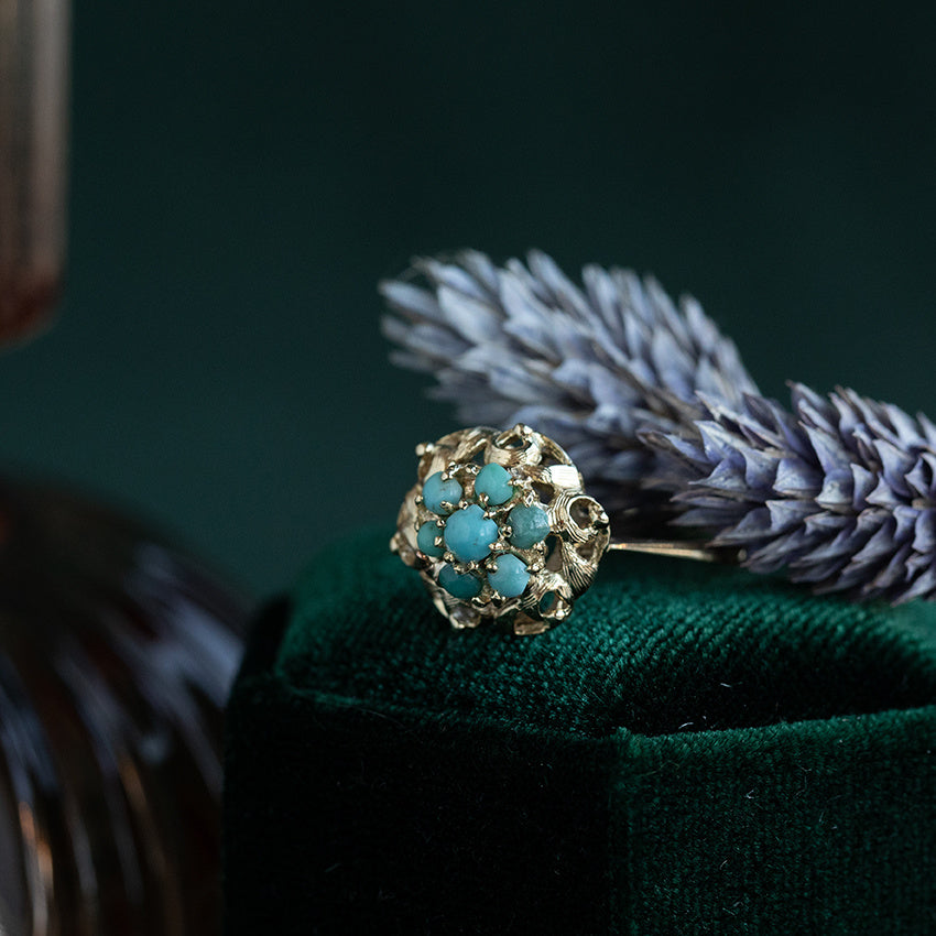 Gold halo ring with turquoise 14 krt