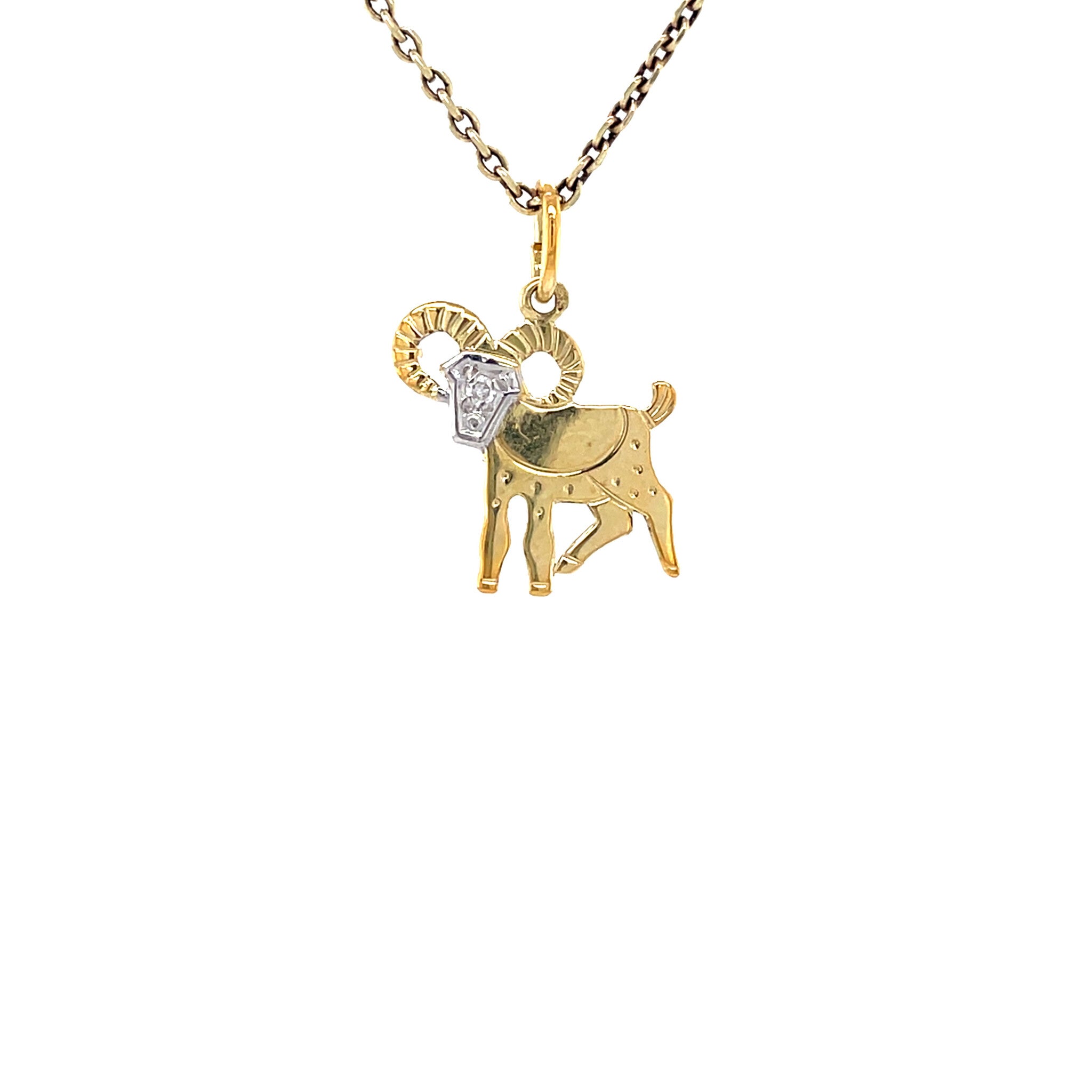 Vintage 14 kt gold ram pendant with diamond