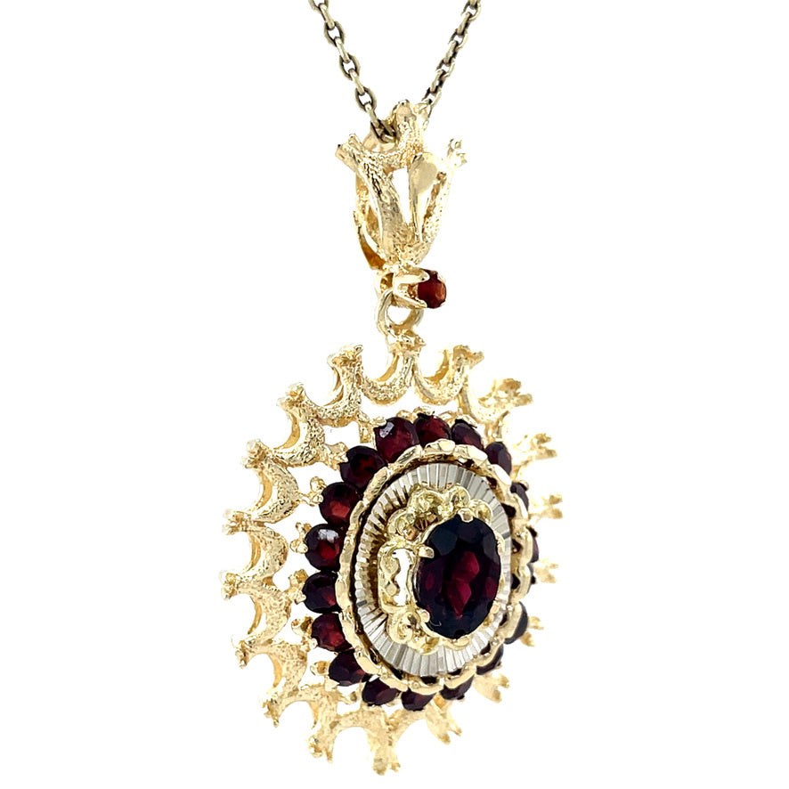 Vintage gold entourage pendant with garnet, 14 kt