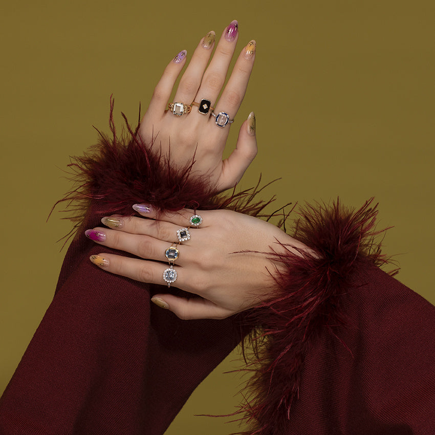 Gouden ring met blauwe topaas en diamant 14 kt