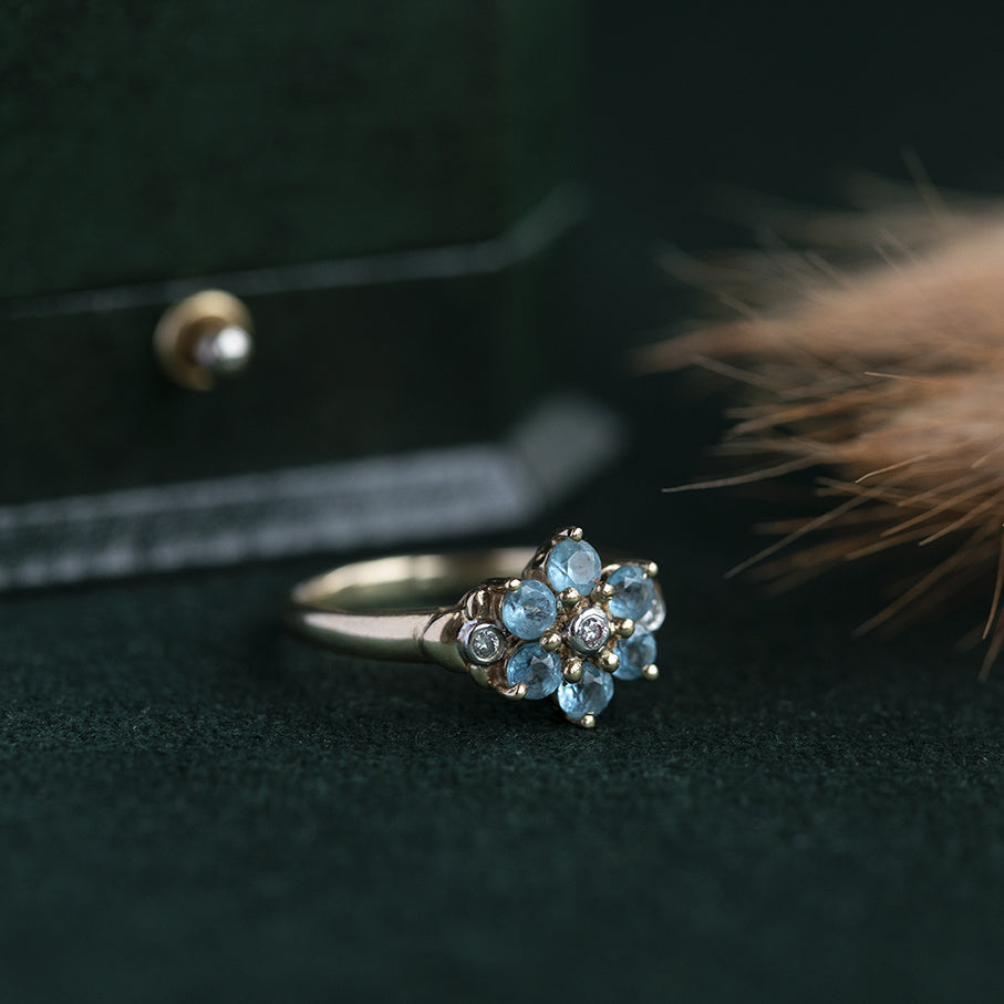 Entourage ring met diamant en aquamarijn 9 krt