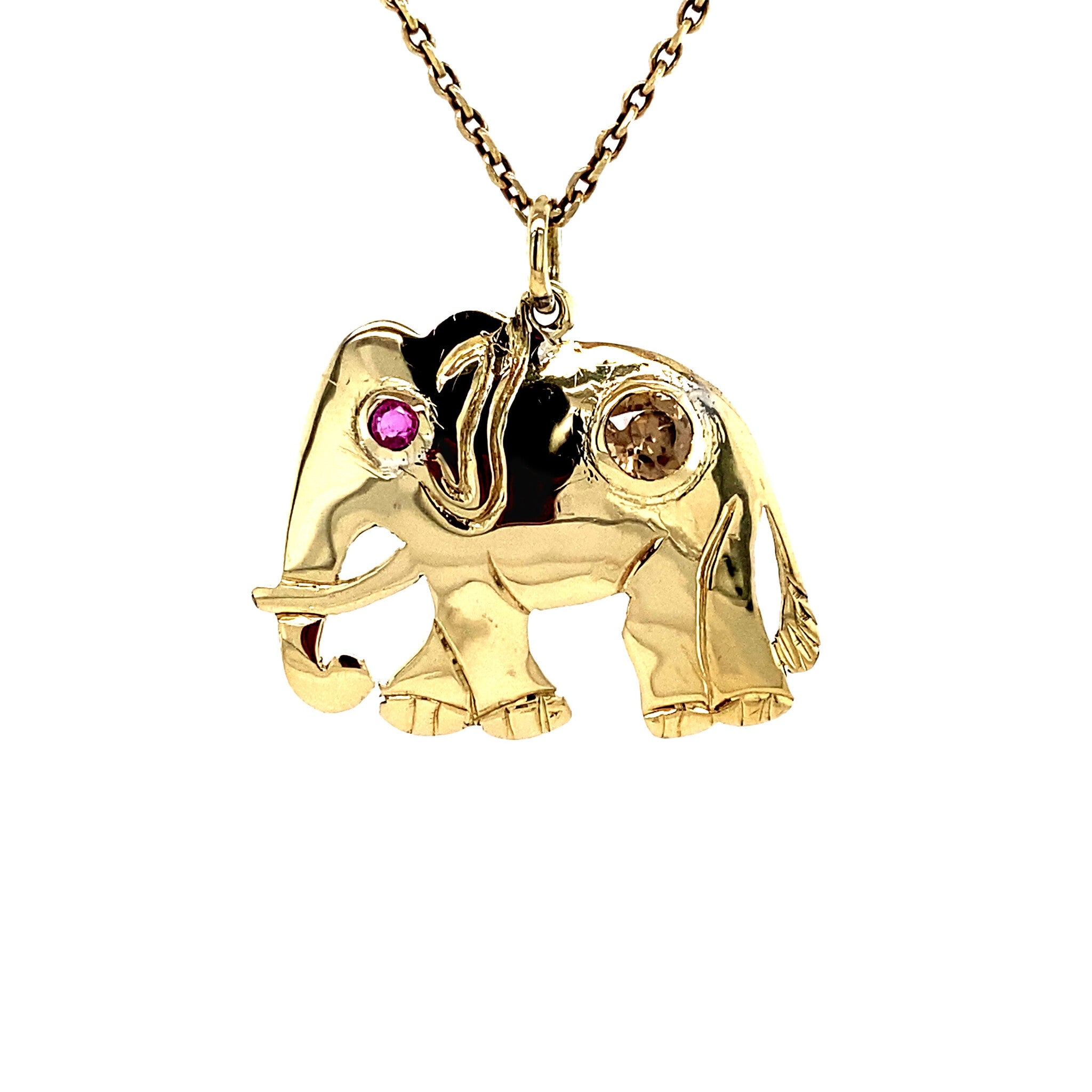 Elephant pendant with ruby and zircon, 12 kt