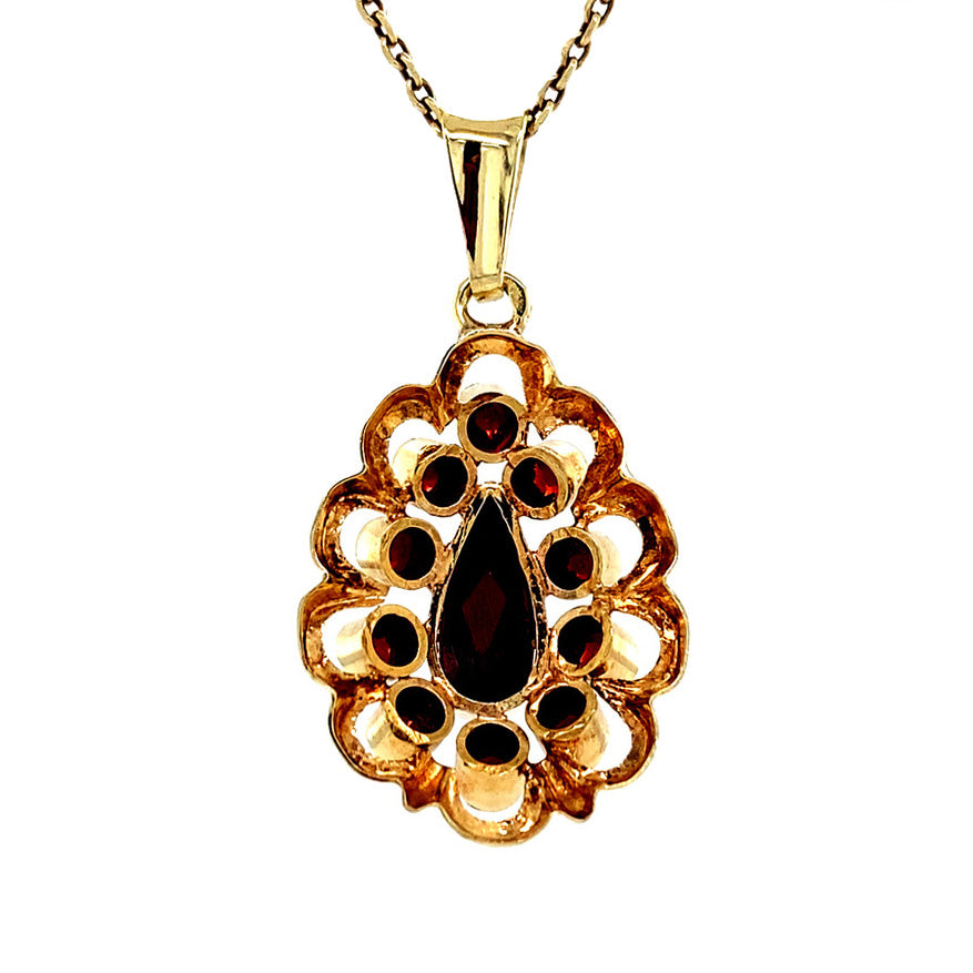 Gouden vintage entourage hanger met granaat 14 krt