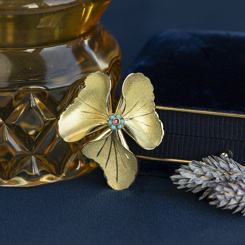 Gouden vintage entourage hanger met robijn en kleursteen 18 kt