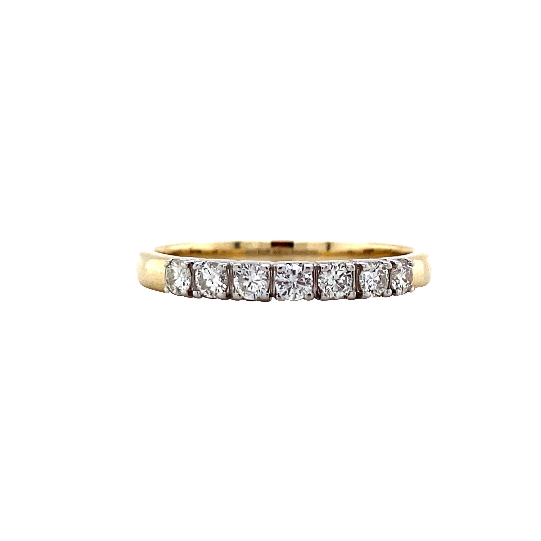 14 kt gold row ring with a diamond.