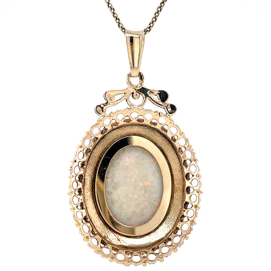 Golden vintage pendant with opal 14 kt