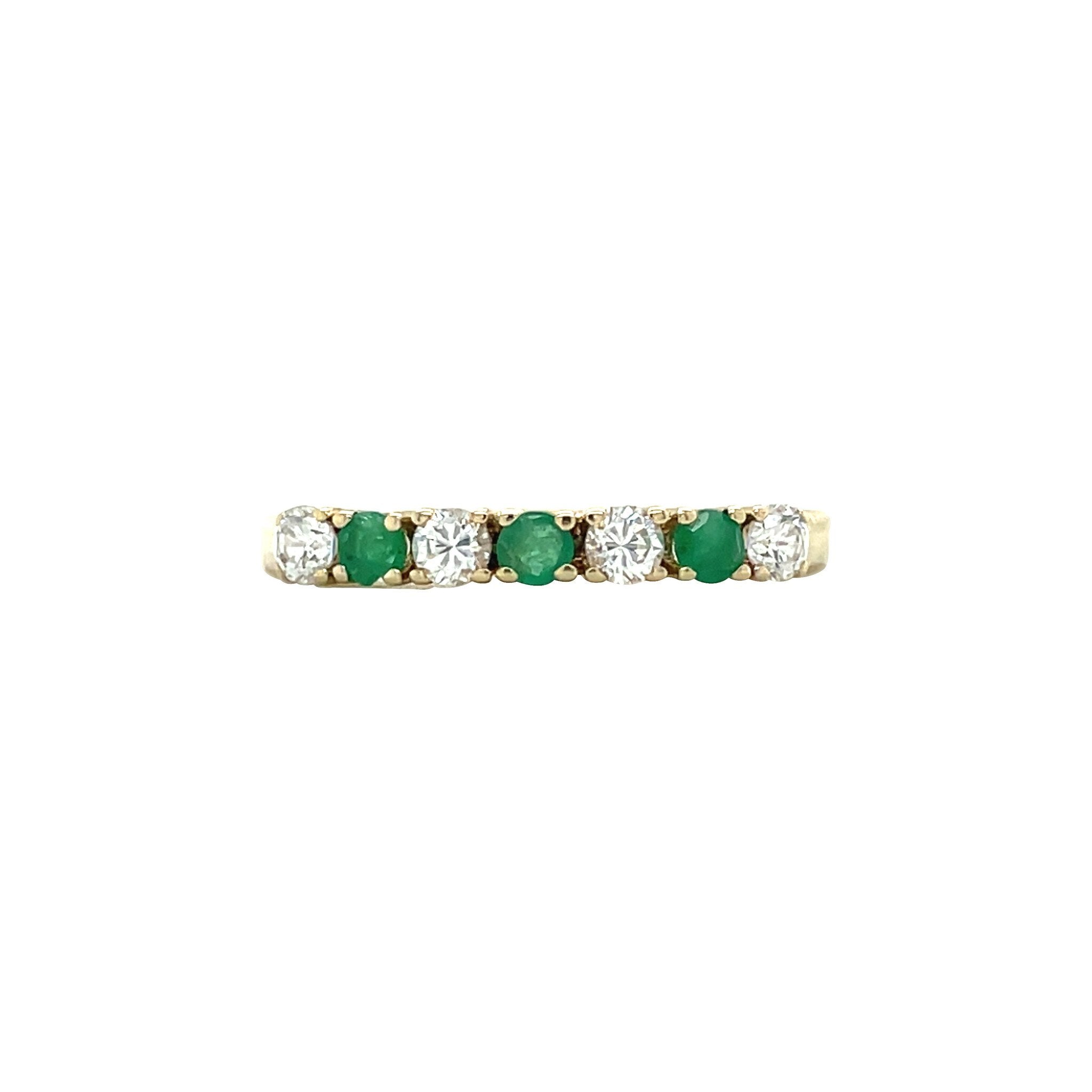 14 kt gold row ring with emerald and zirconia