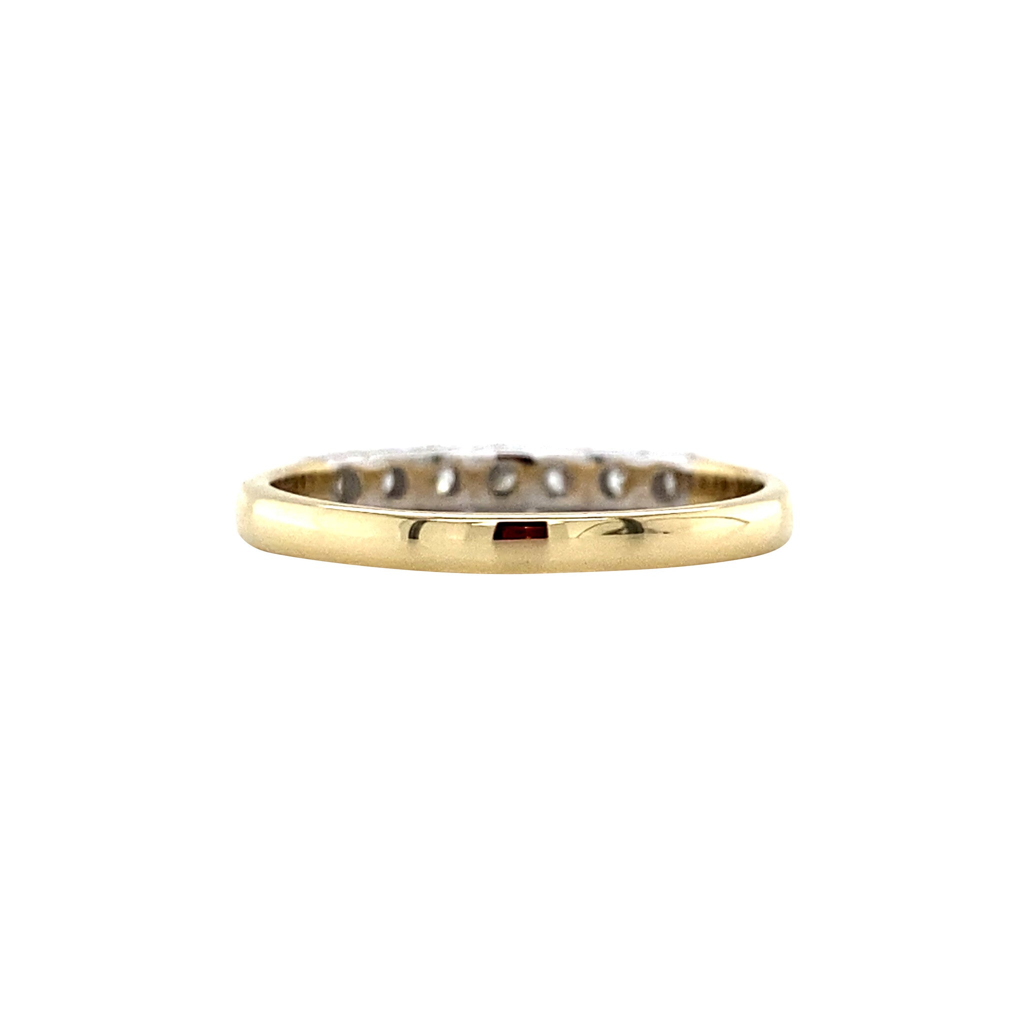14 kt gold row ring with a diamond.